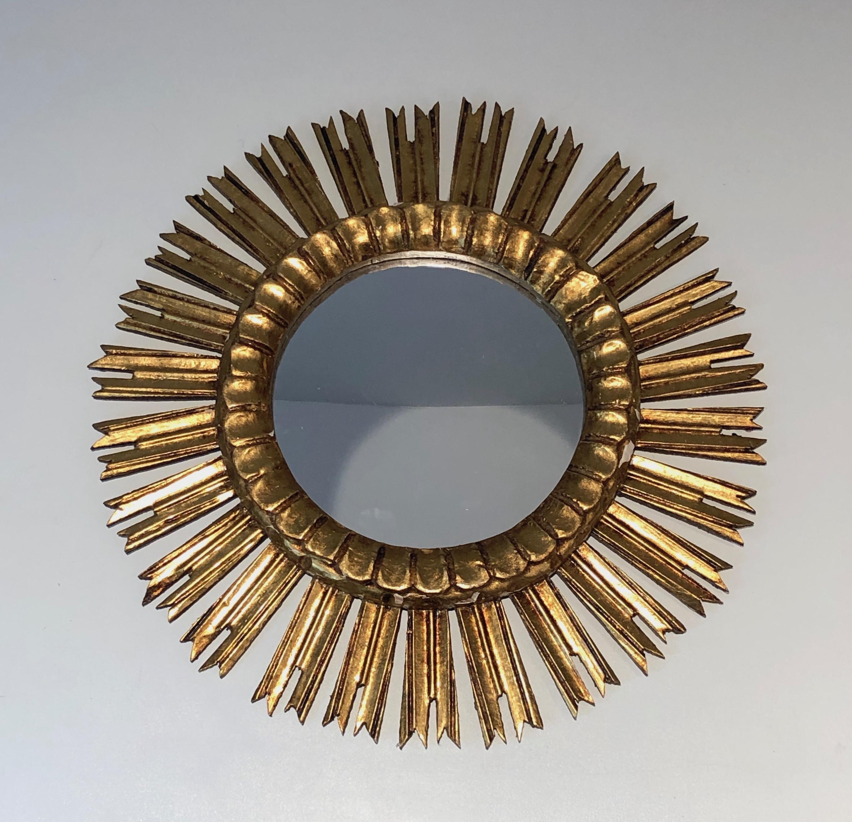 Gilt wood sunburst mirror. French. Circa 1970.