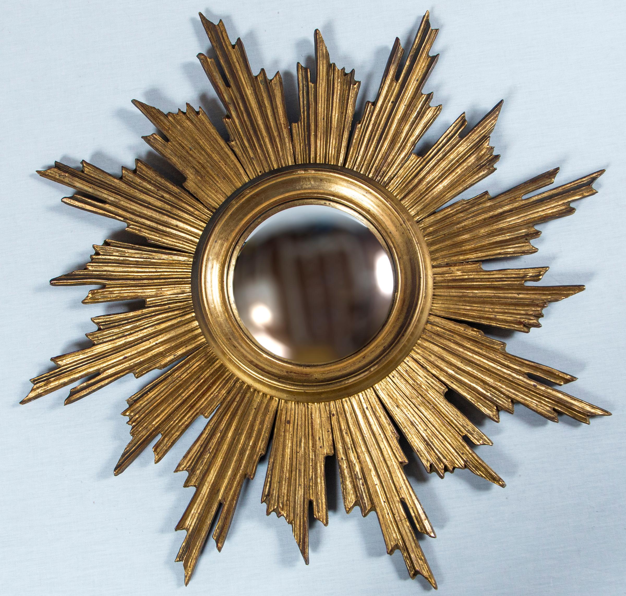 Giltwood Sunburst Mirror, France, mid-20th century. Original convex glass. Hand carved wood frame with original gilt finish.