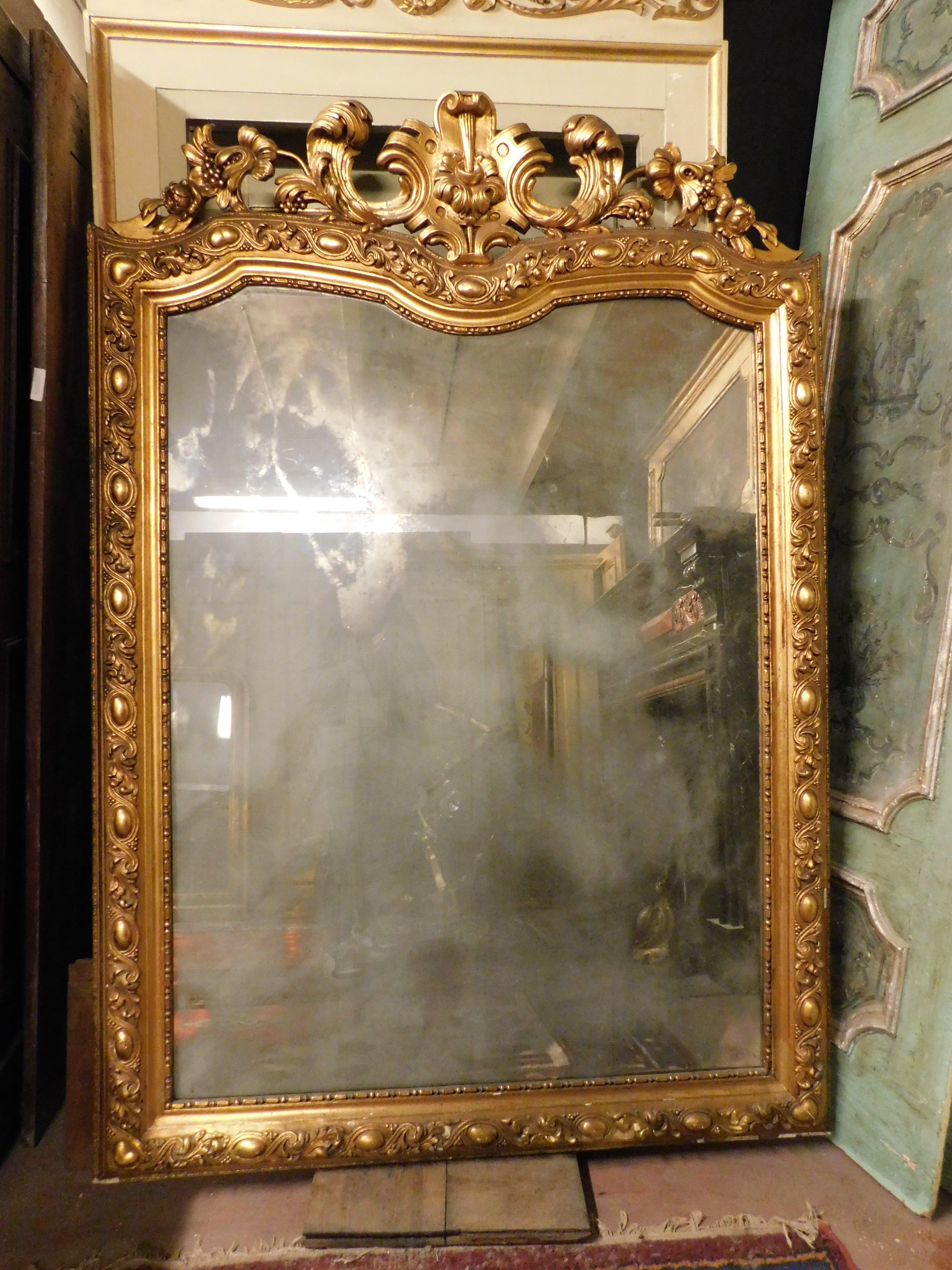 Hand-Carved Gilt wooden wall consolle mirror with carved cymatium, Italy For Sale