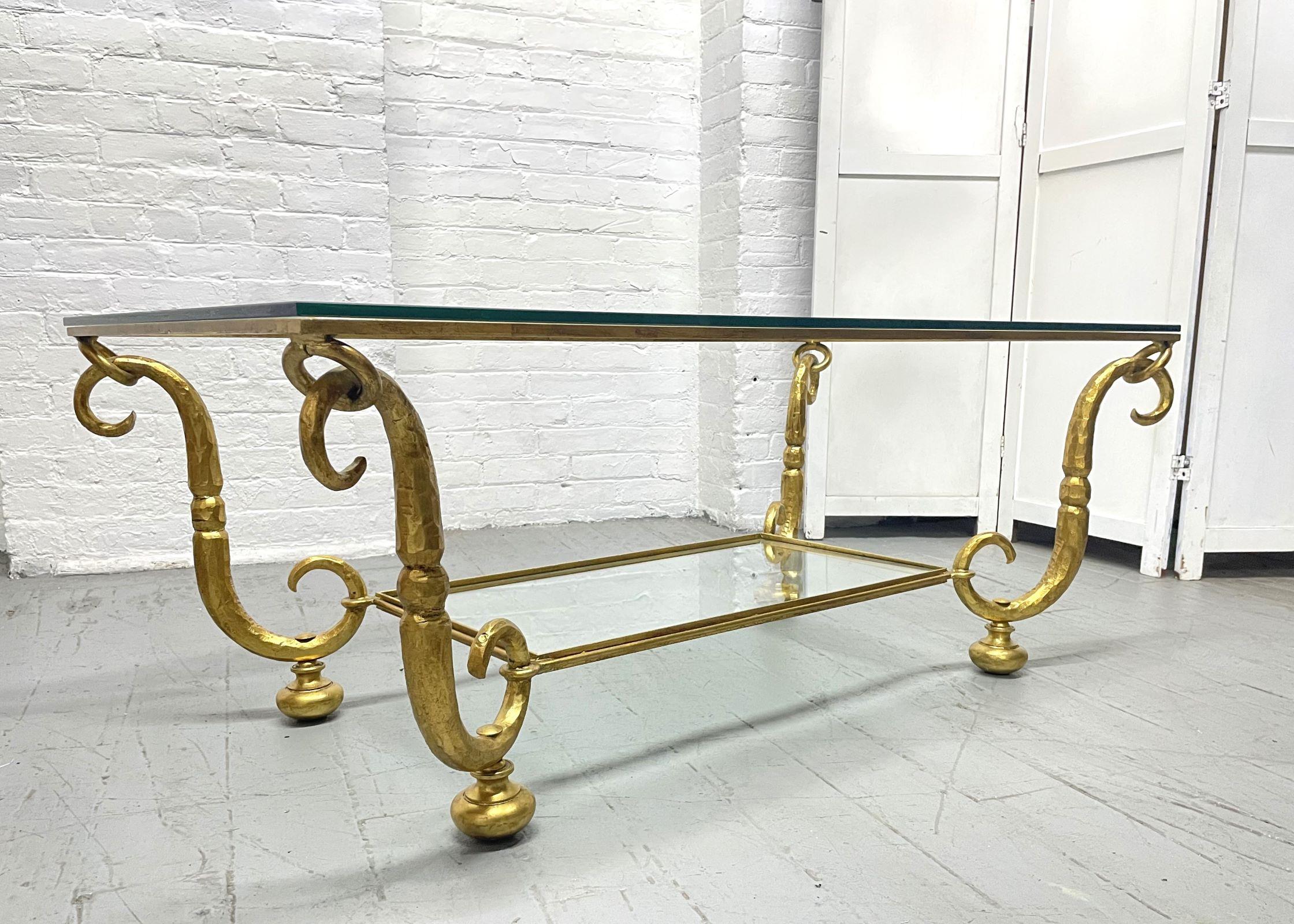 Gilt Wrought Iron and Glass Top Coffee Table.  The table has brass gilded feet, scroll pattern frame and the lower tier has a glass top as well.