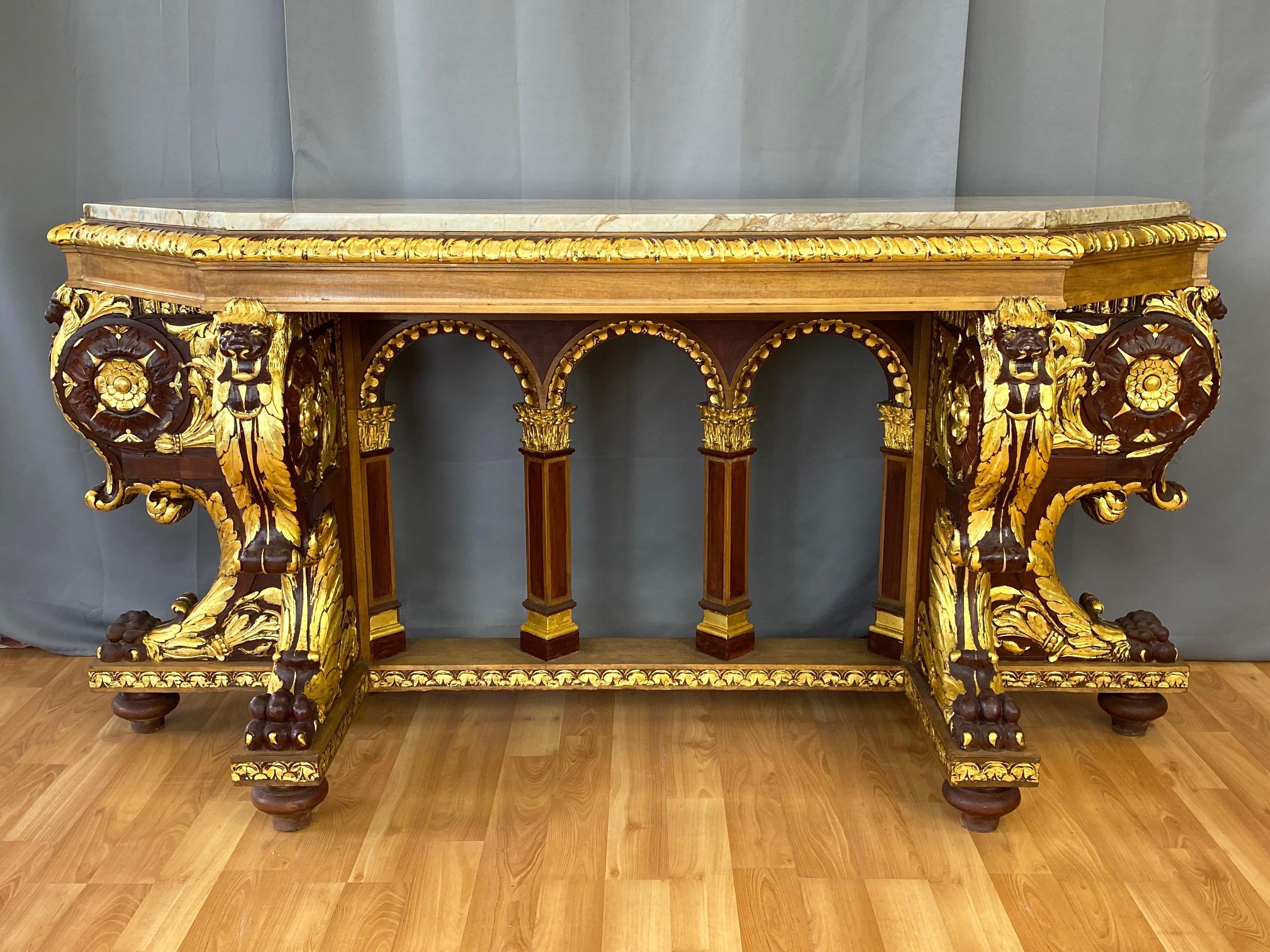 An incredibly grand and commanding early 1900s Regency-style parcel-gilt mahogany console table with marble top, from the historic Fairmont Hotel atop Nob Hill in San Francisco, California.

Impressively sized and well-executed hand-carved solid