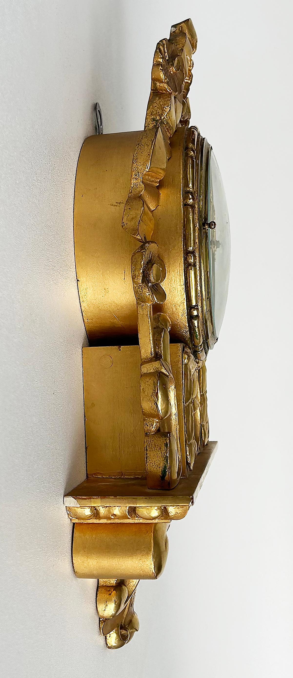 Giltwood Cartel Wall Clock Complete, Original Key, Enameled Face, Pendulum In Good Condition For Sale In Miami, FL