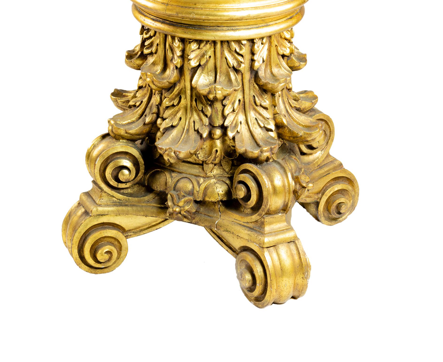 A four-legged, corinthian-style carved chestnut italian gueridon with golden leaf, acanthus and scroll rocaille, foliate and scrollwork extravagant.