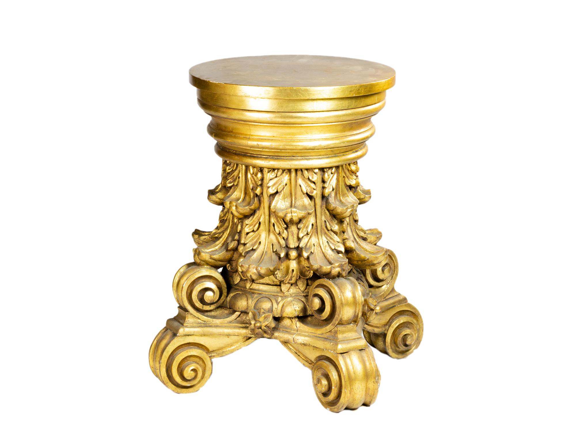 A four-legged, corinthian-style carved chestnut italian gueridon with golden leaf, acanthus and scroll rocaille, foliate and scrollwork extravagant.