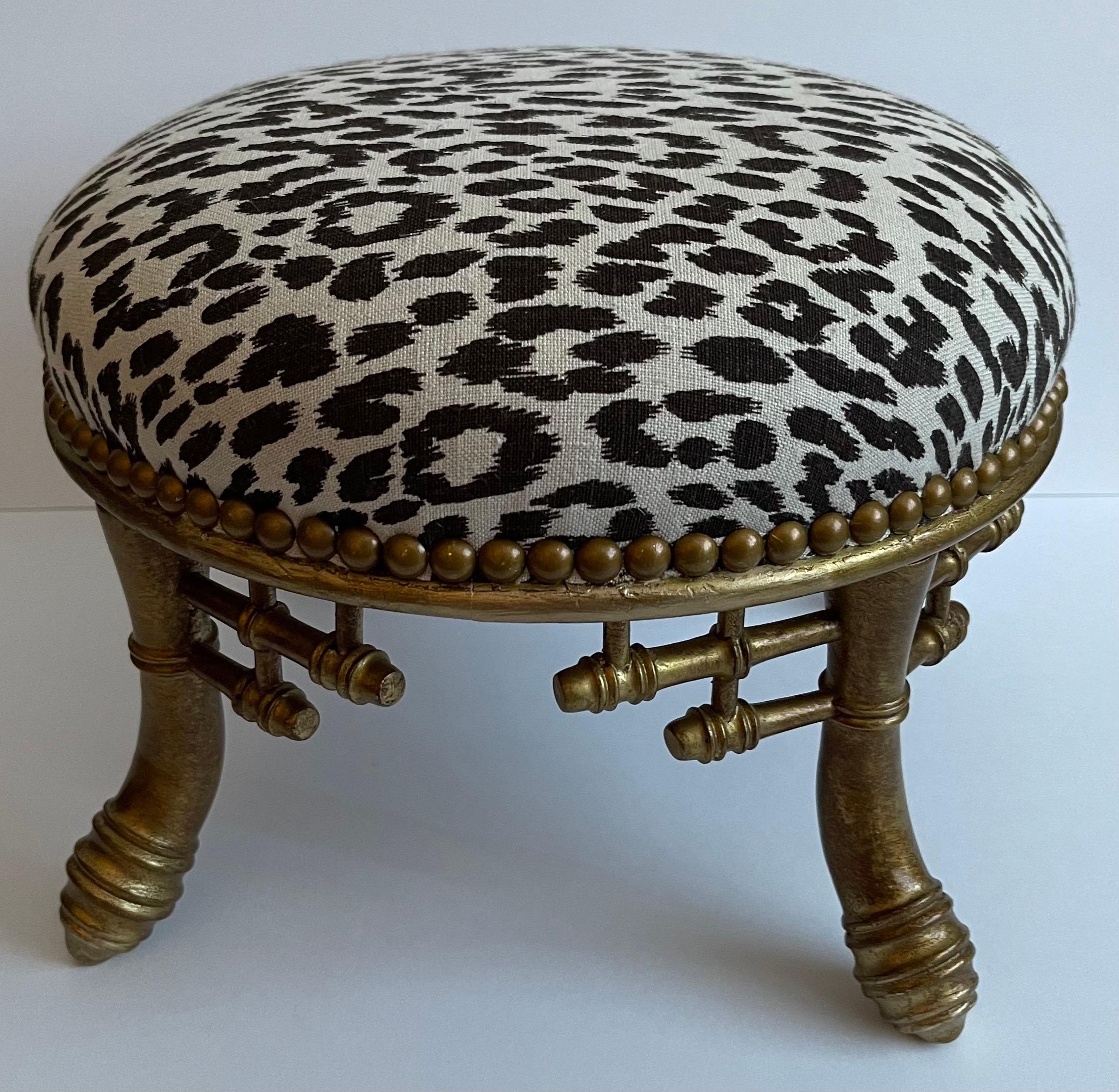 Small round antique giltwood bamboo stool. Newly upholstered in Raoul Textiles leopard linen fabric. Brass nailhead detailing.