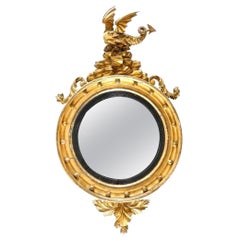 Specchio convesso in legno dorato del XIX secolo