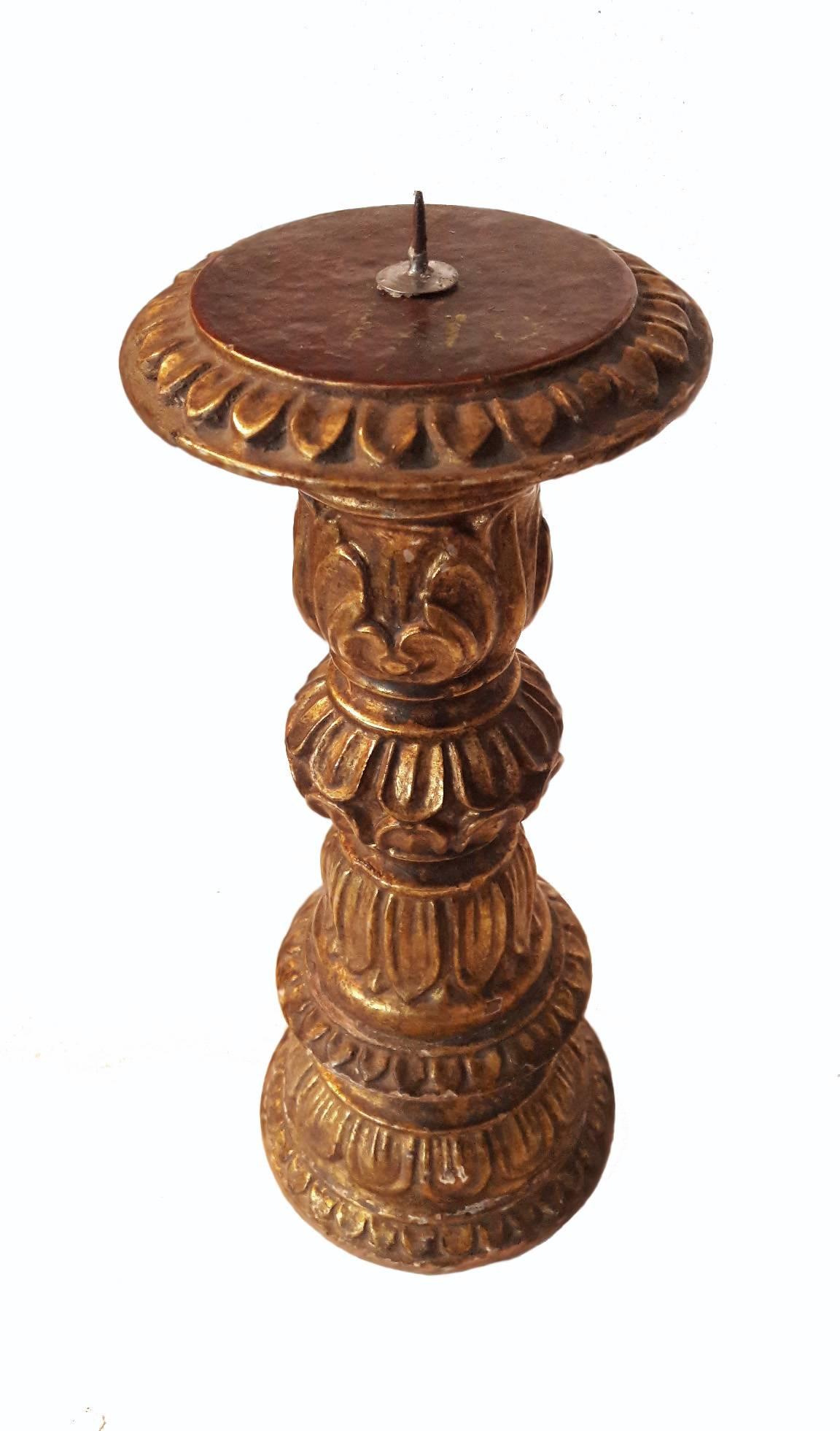 A gilded wood candlestick from India, ornately hand carved. Circa 1990. 