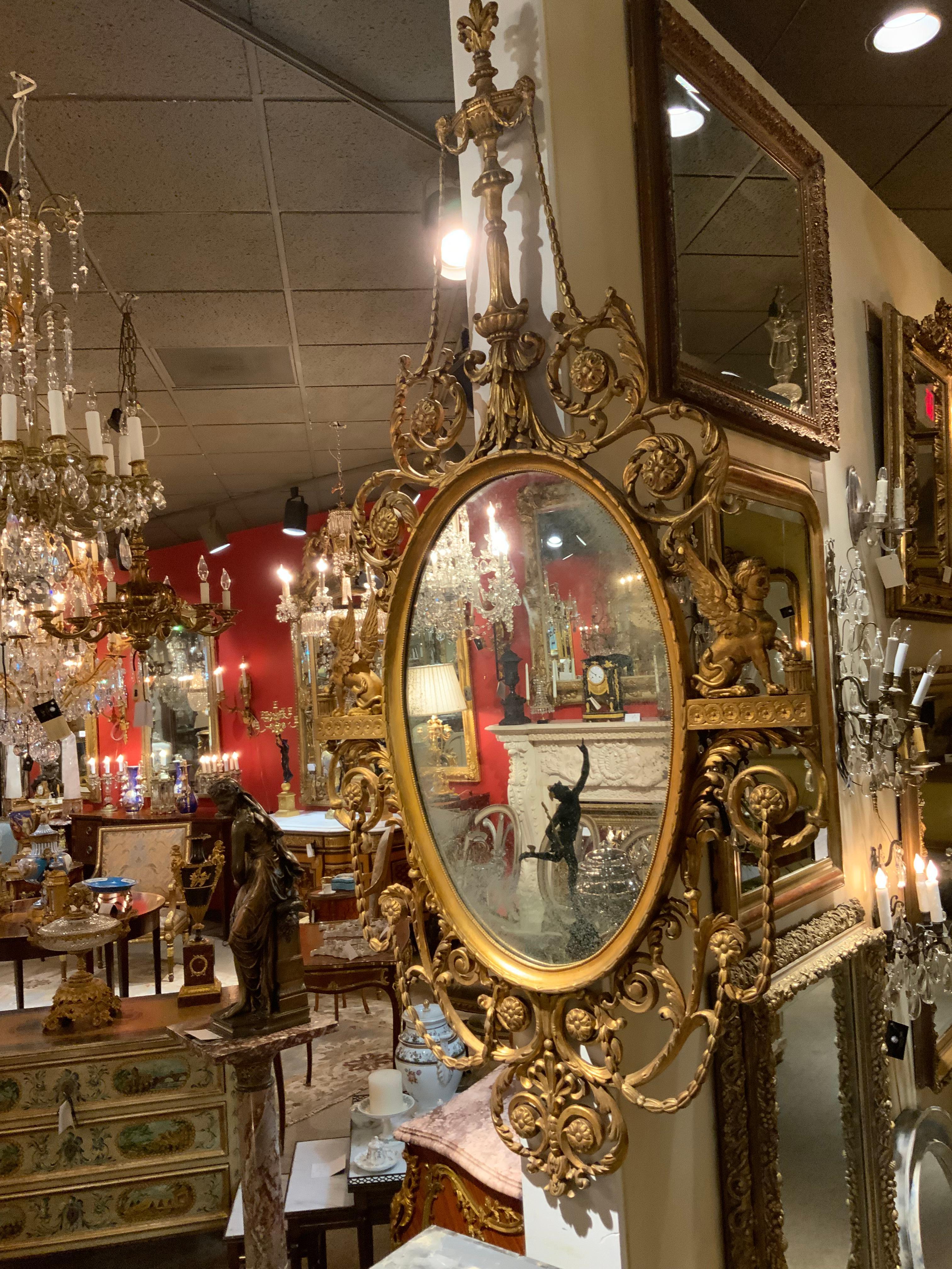 Sculpté Miroir Empire en bois doré C.I.C. en vente