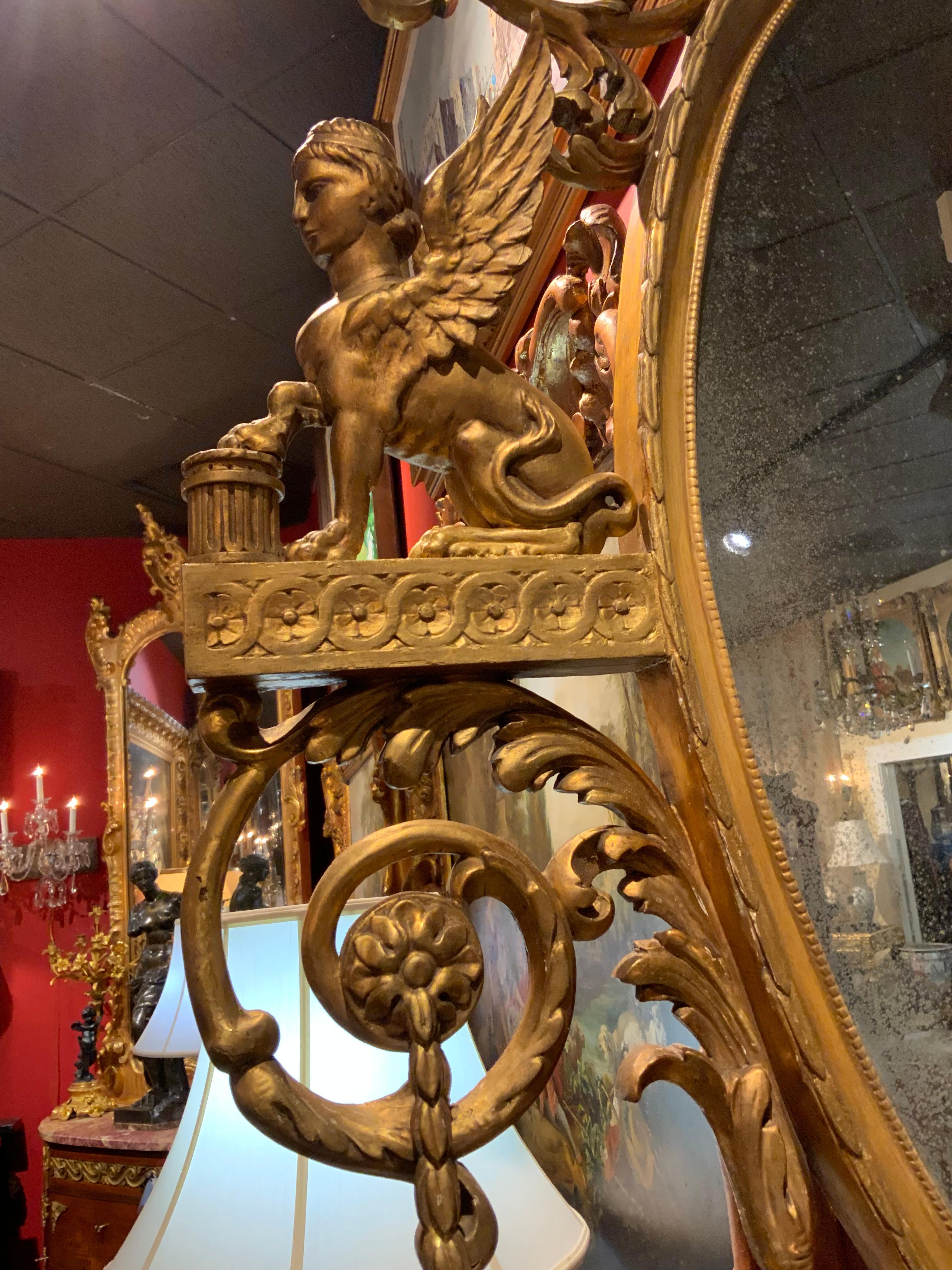 Bois doré Miroir Empire en bois doré C.I.C. en vente