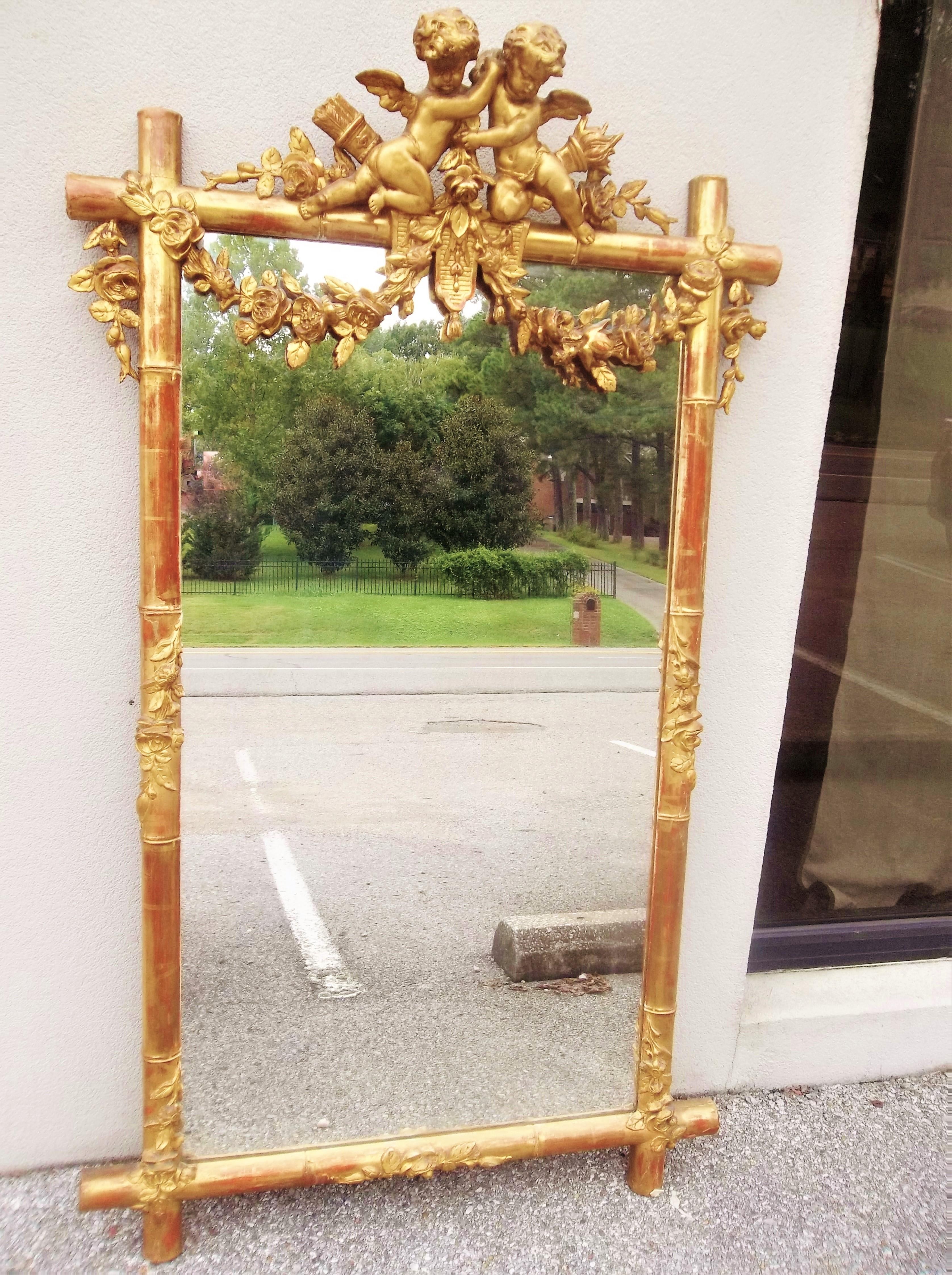 Giltwood Faux Bamboo Mirror with Cherubs or Putti Crest with Floral Garlands In Good Condition In Nashville, TN