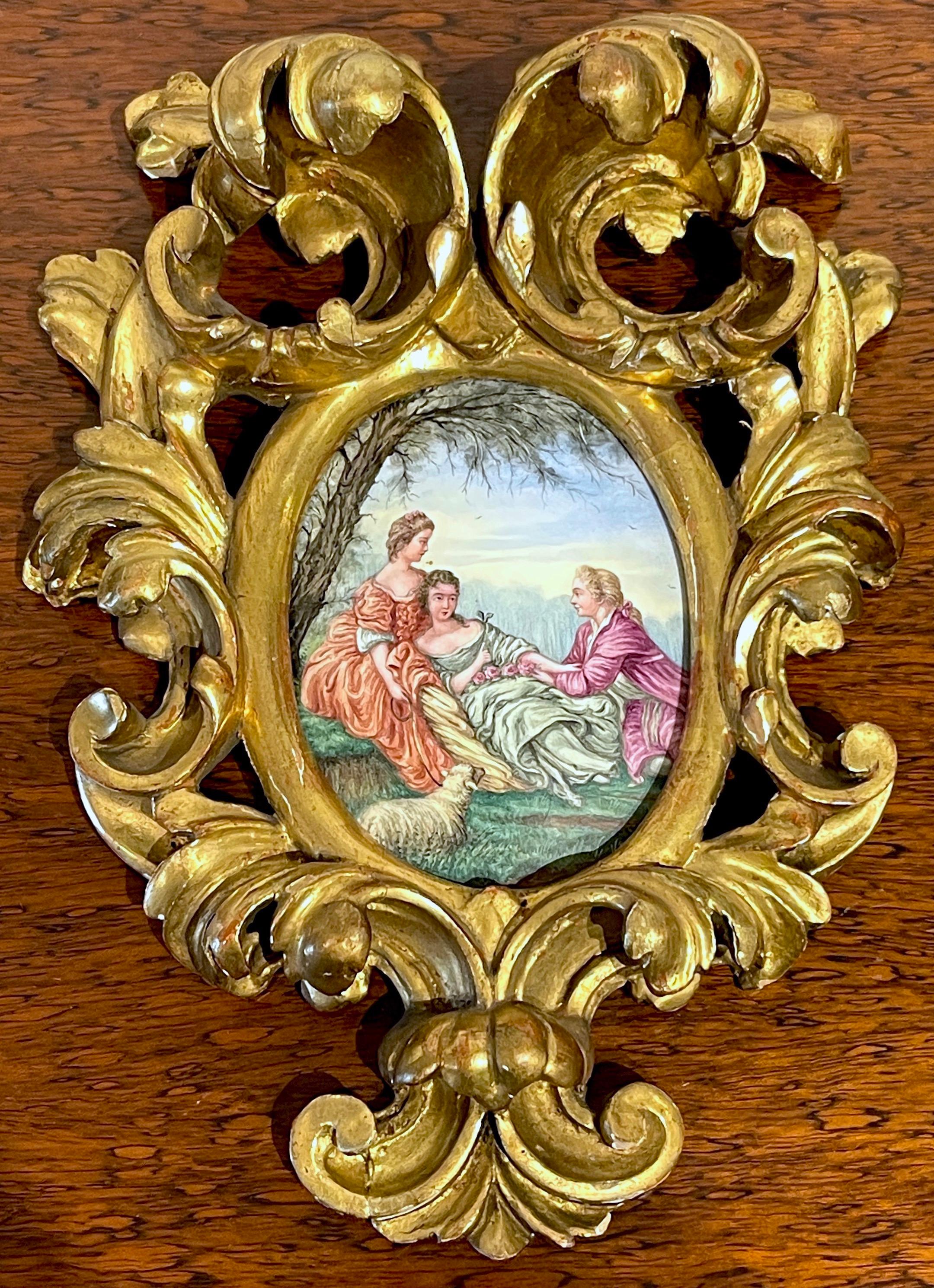 Giltwood Framed Limoges Enamel after François Boucher 'Shepherds Idyll '
France, Circa 1880s
Framed in an elaborate hand carved  pierced and giltwood  three- dimensional  Baroque style frame, The 3-Inch x 5-inch enamel on copper of  vignette of 