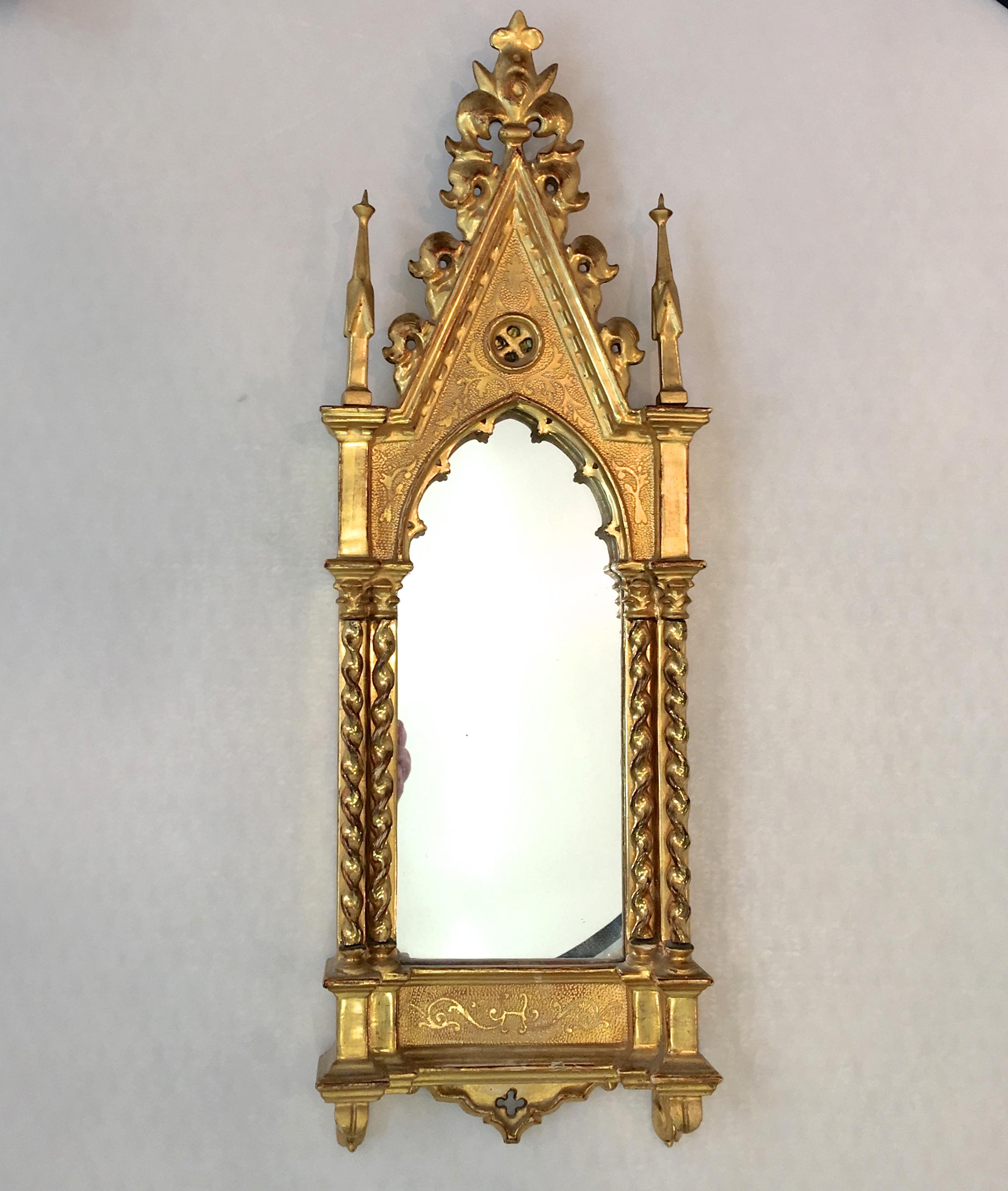 A mirror in water giltwood and gesso pierce carved Italian cathedral frame. Grand Tour, circa 1850. Originally would have held an ecclesiastical painting on board of an angel detail after Fra Angelico's Linaioli altar piece, Museo di San MarCo,