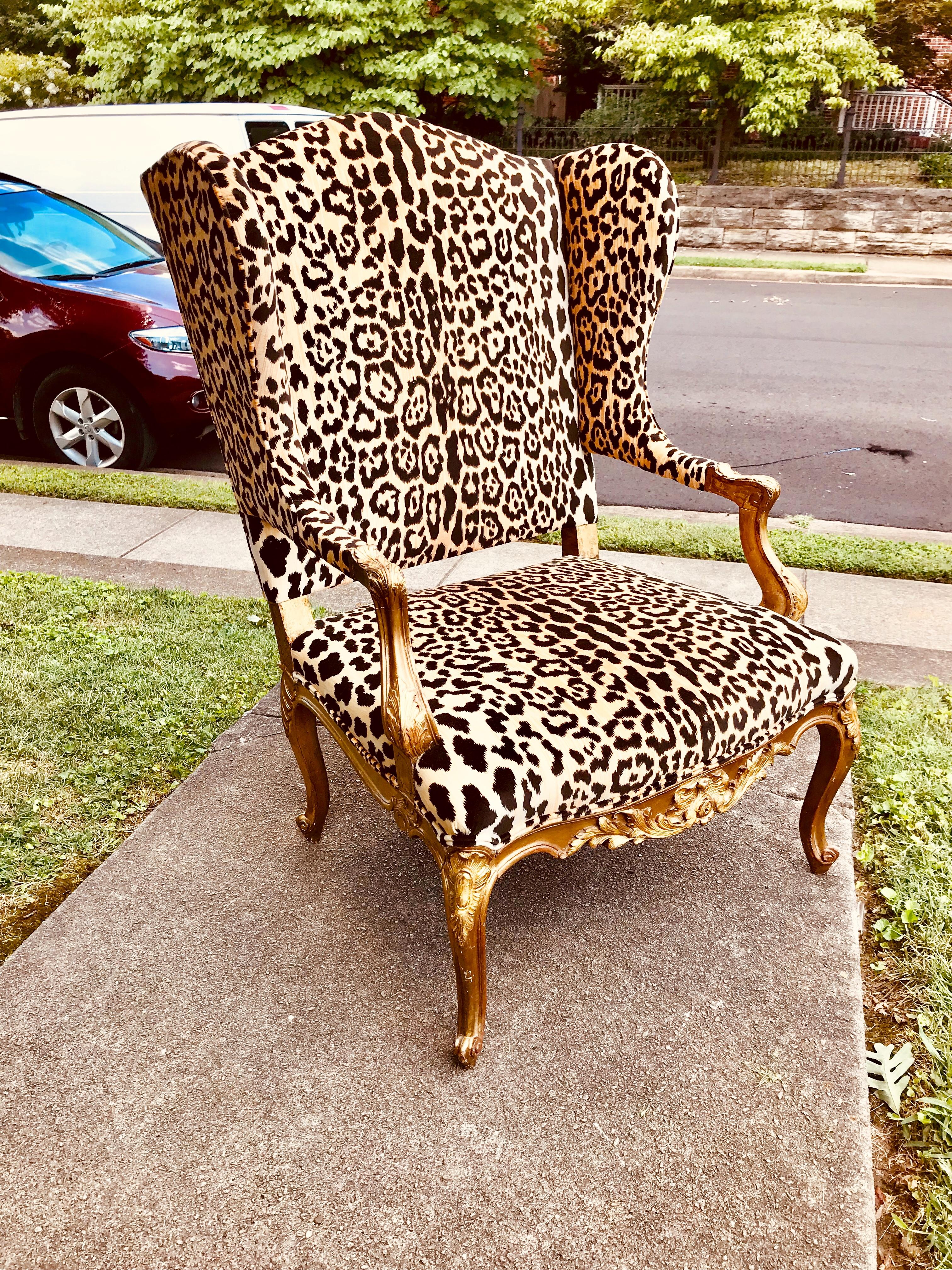 French Louis XV style giltwood wing chair in Scalamandre leopard velvet.
Large, commodious, accommodating modern American men. Sturdy frame.
The gilding nicely patinated and worn. Losses from time ,wear and use .Touch ups, in-painting and some