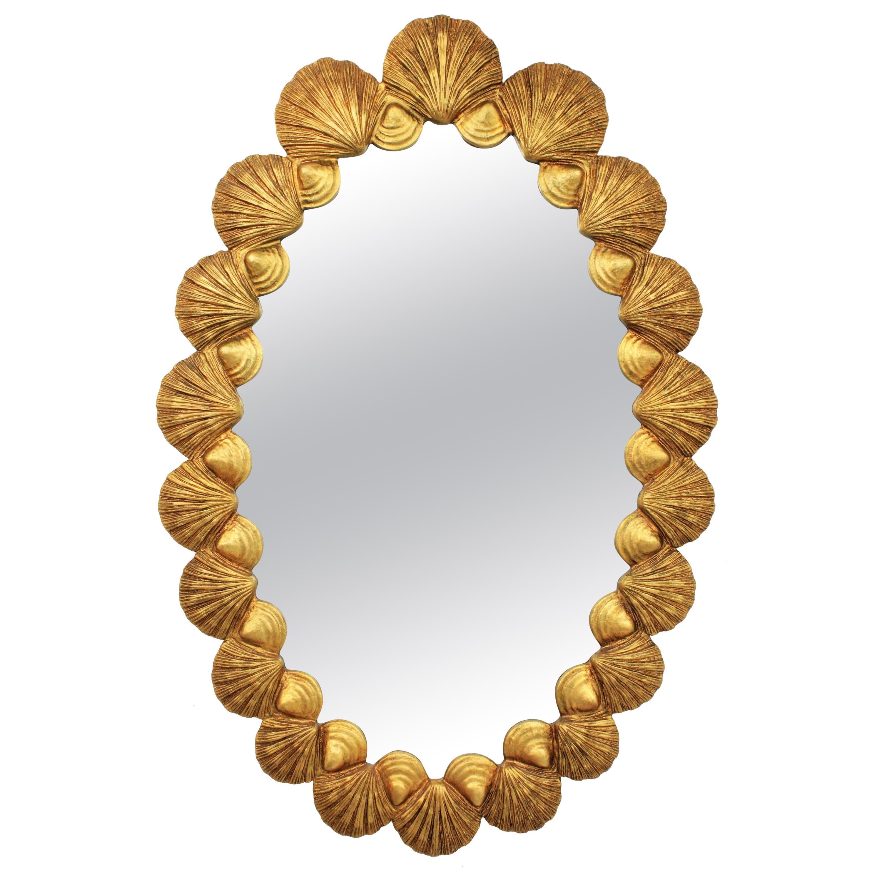 Hollywood Regency giltwood oval mirror with carved shells frame by Francisco Hurtado, Spain, 1950s
One of a kind finely carved oval large mirror with an exquisite hand carved shell motif frame.
This mirror was handcrafted at the Mid-Century Modern