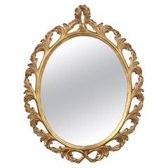 Specchio da parete ovale in legno dorato