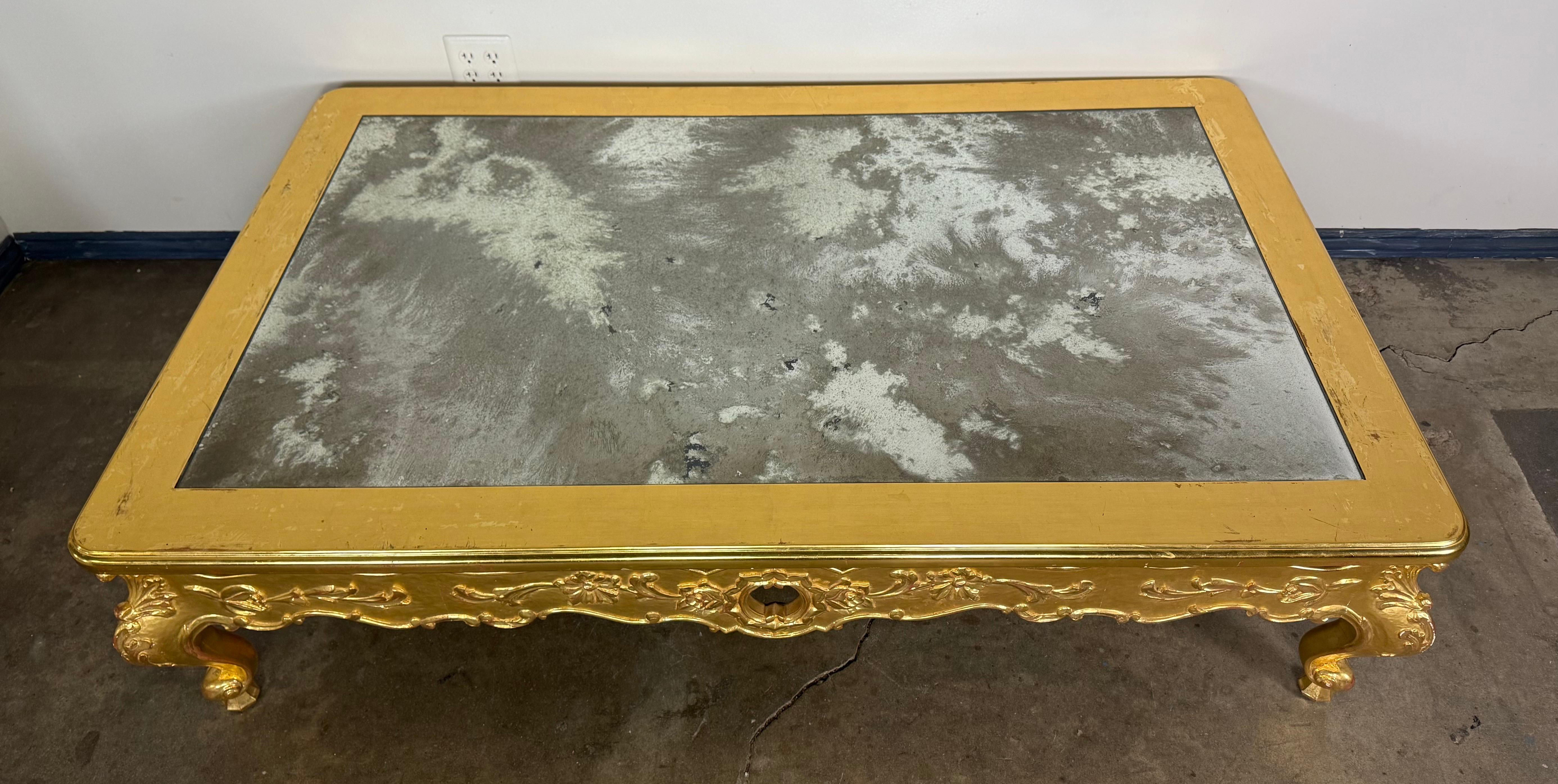 Hollywood Regency Giltwood Rococo Coffee Table with Antiqued Mirrored Top For Sale