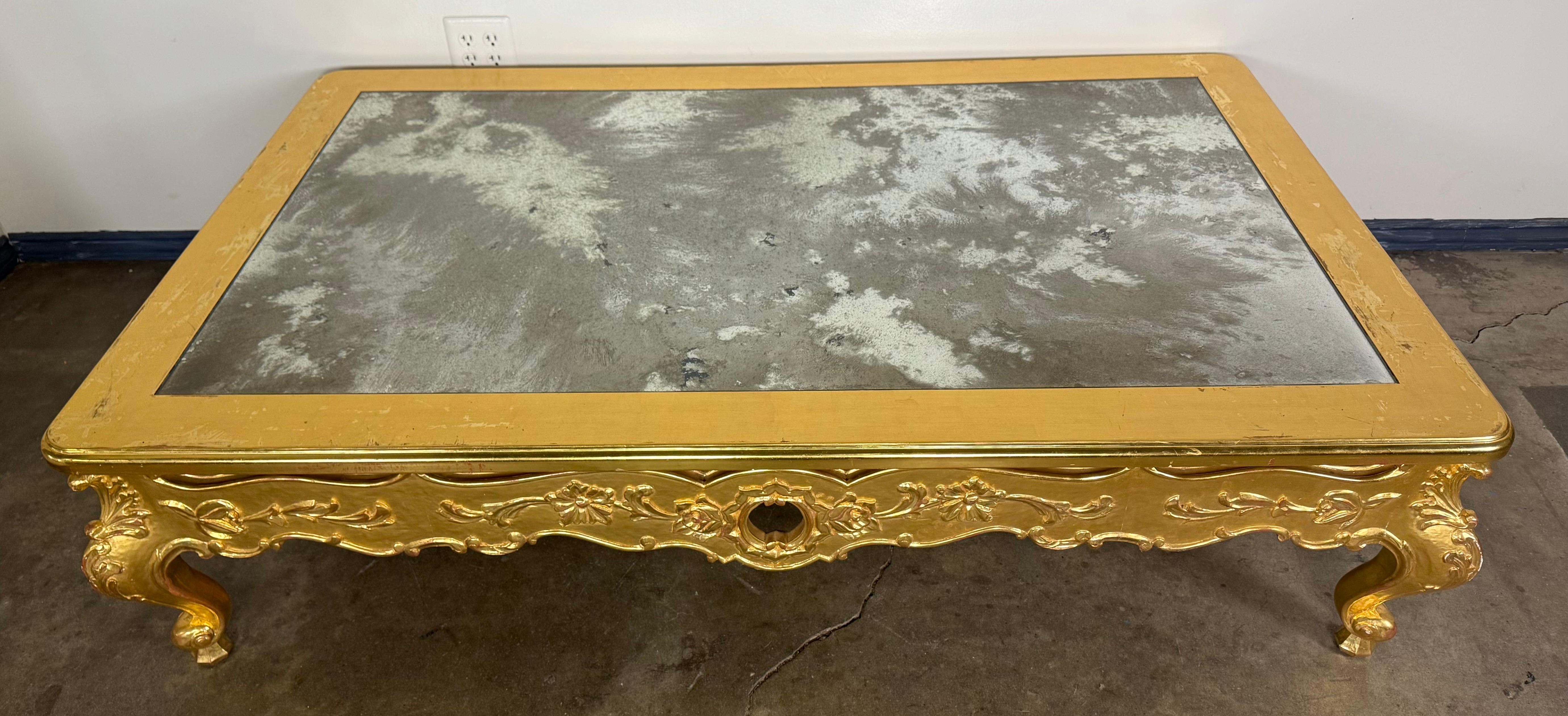 American Giltwood Rococo Coffee Table with Antiqued Mirrored Top For Sale