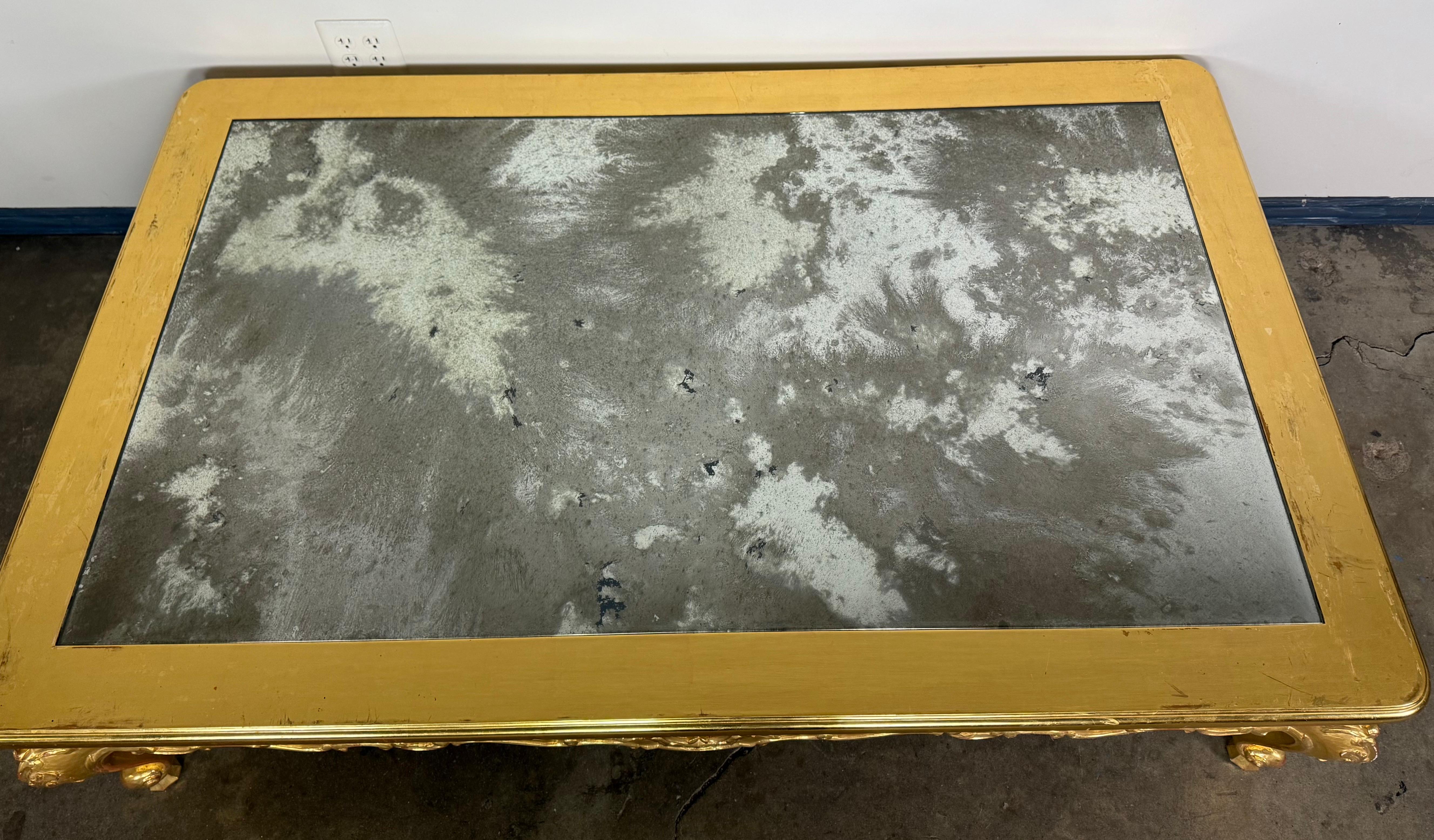 Giltwood Rococo Coffee Table with Antiqued Mirrored Top In Distressed Condition For Sale In Los Angeles, CA