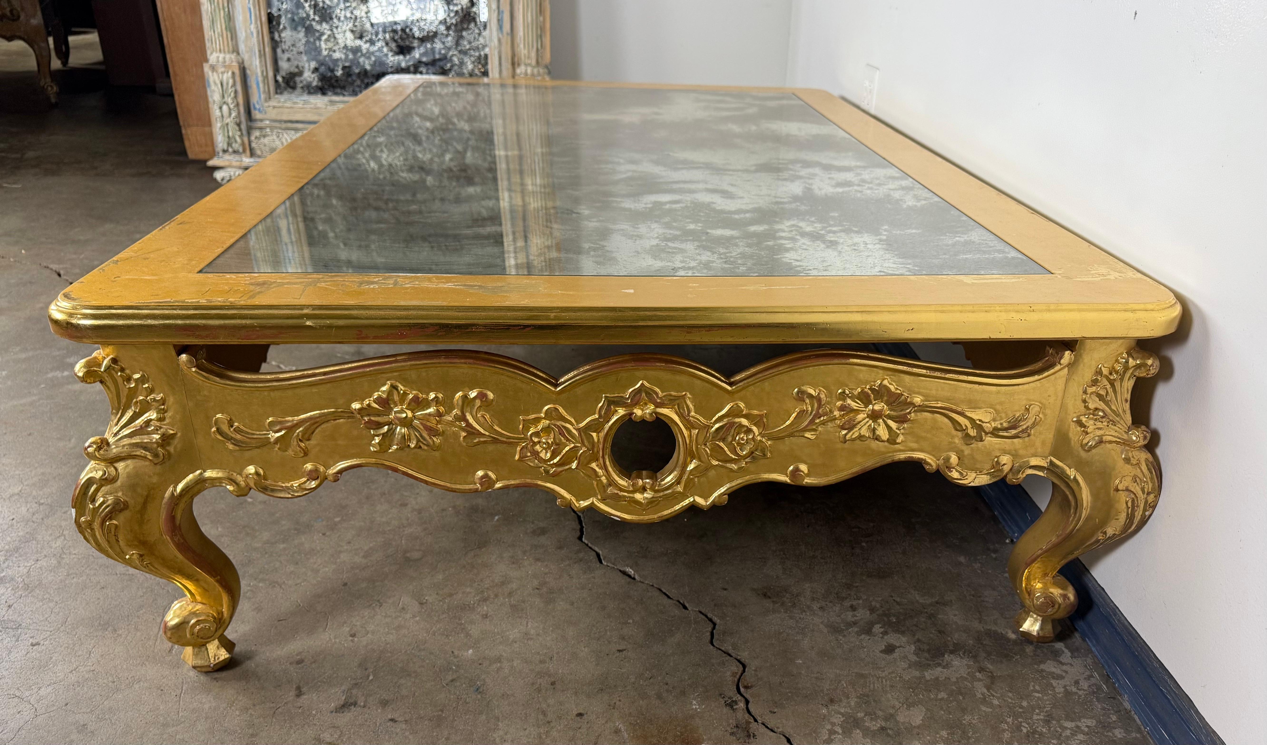 20th Century Giltwood Rococo Coffee Table with Antiqued Mirrored Top For Sale