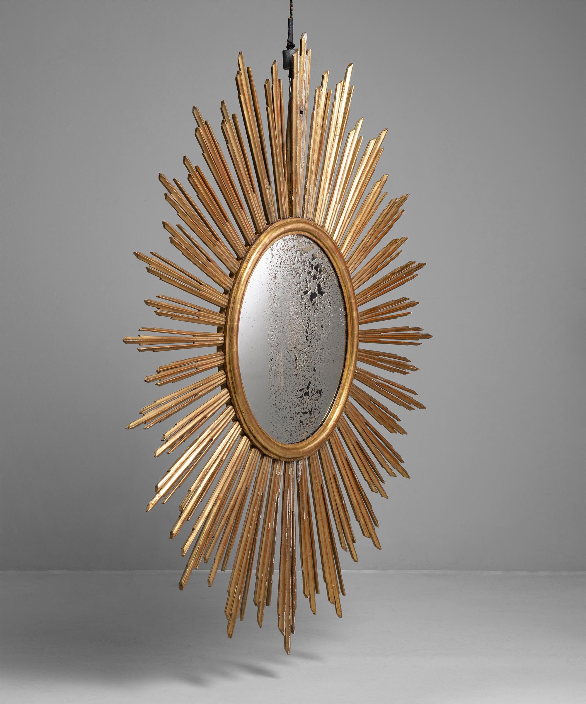 Giltwood sunburst mirror,
France, circa 1800

Beautifully carved gilt wooden frame with original foxed mirror plate.

Measures: 81.5” W x 62.5” D x 2.75” H

$ 18,500.

 