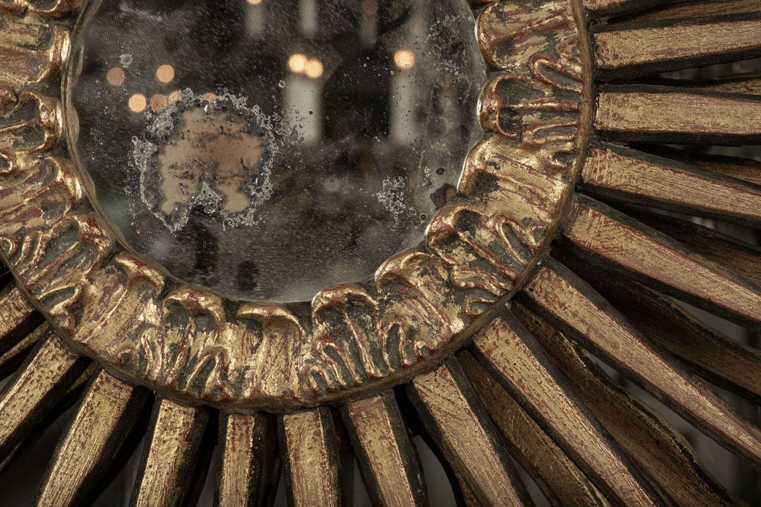 Giltwood sunburst mirror, circa 1910, France. Hand-carved with original gilded finish and mirror glass.
