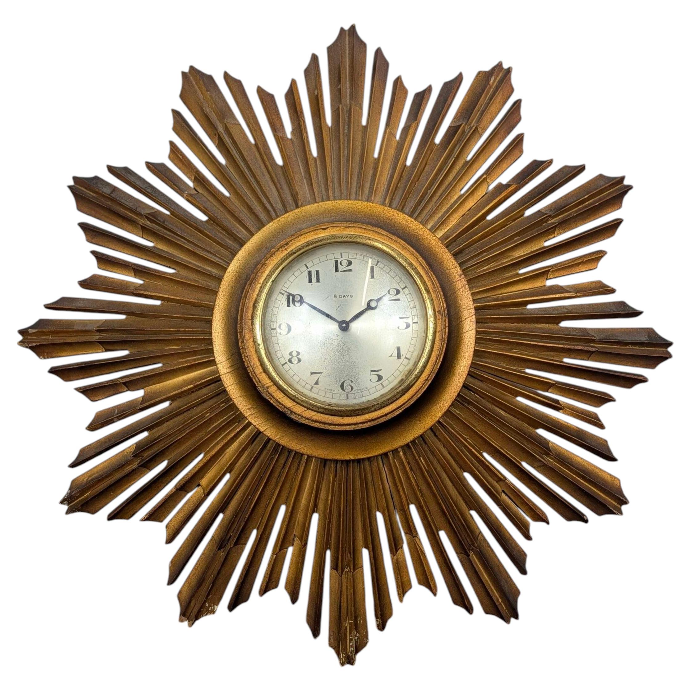 Giltwood sunburst wall clock with Swiss 8 day movement, mid 20th For Sale