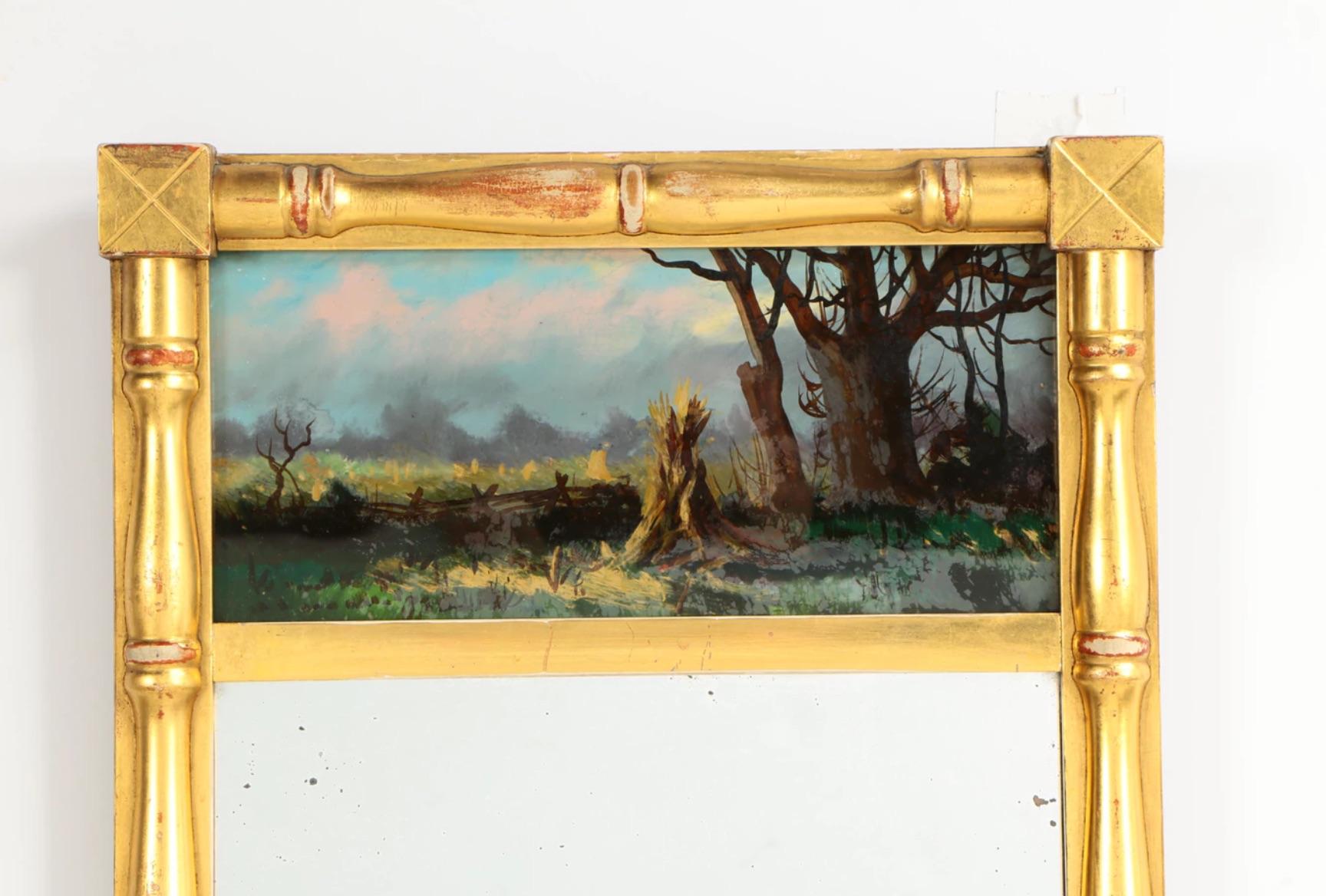 To the manner born mirror!
A superb 19th century American Classical  giltwood split Balluster Trumeau mirror with reverse painted glass field scene.
A lovely giltwood Trumeau mirror The top scene is a reverse glass painting of a winter landscape.