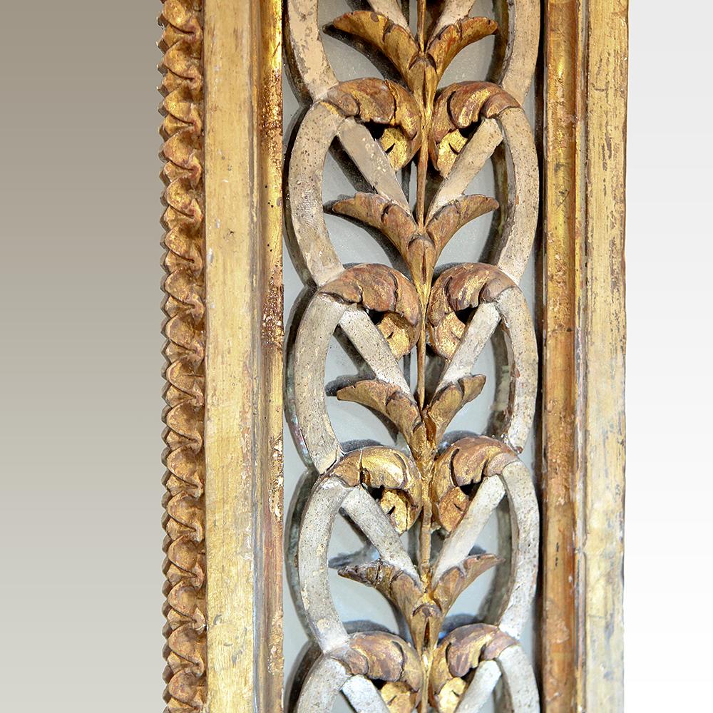 19th Century carved giltwood reticulated mirror. A large rectangular mirror with superb carved detail with applied lattice ornamentation with a gilt and painted finish.