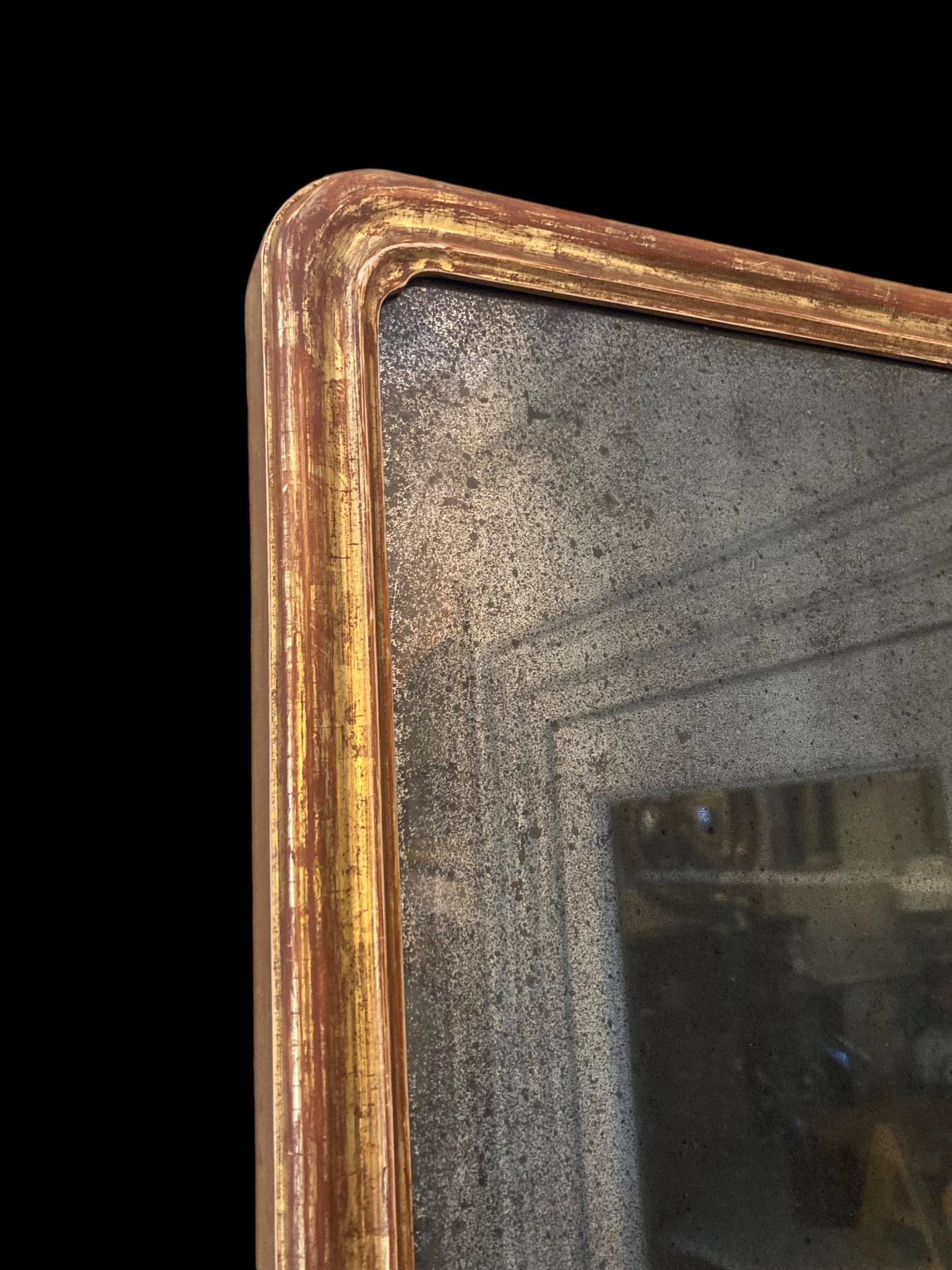 18th Century and Earlier Giltwood wall mirror with single brass candle arm For Sale