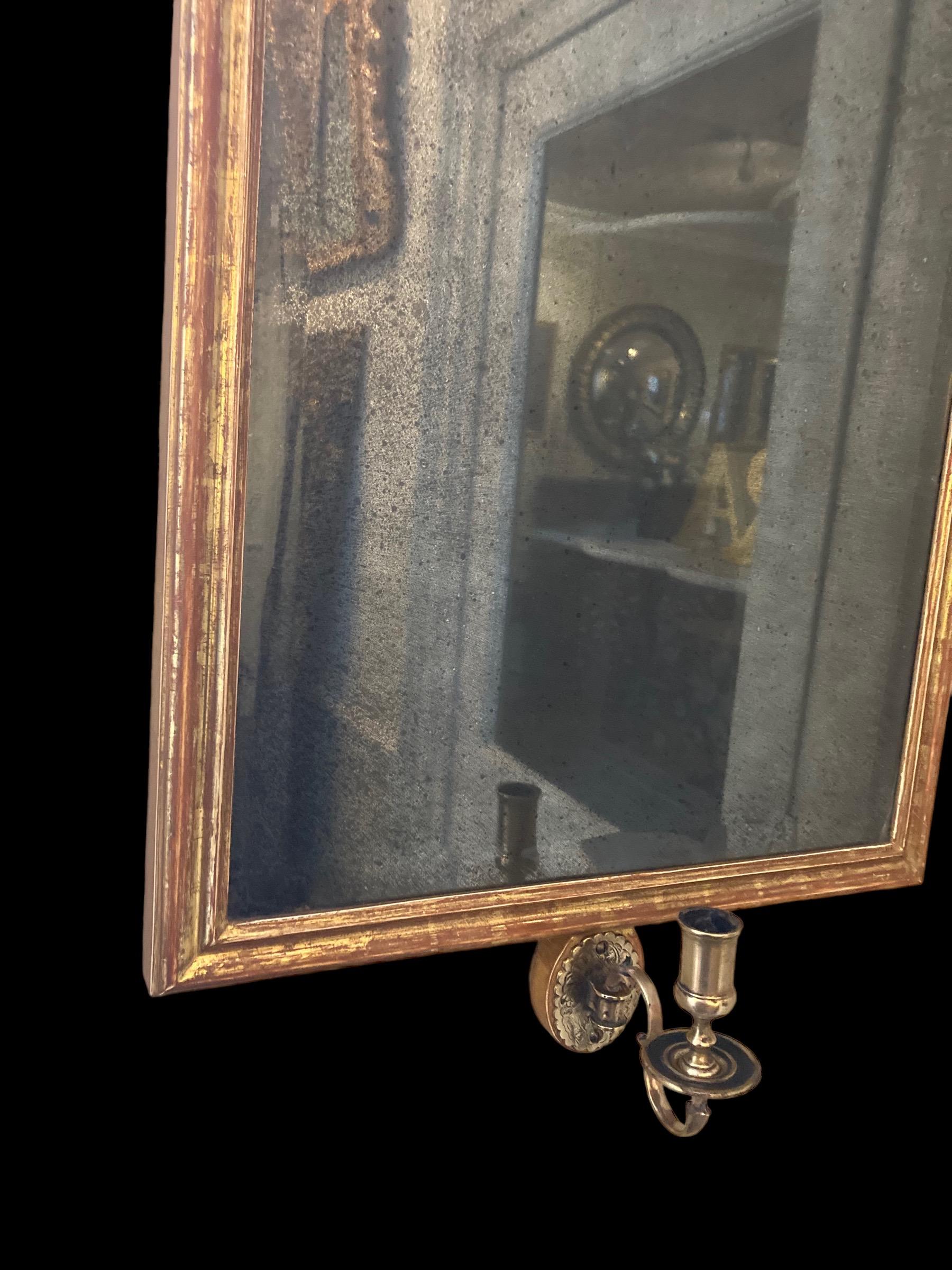 Giltwood wall mirror with single brass candle arm For Sale 1