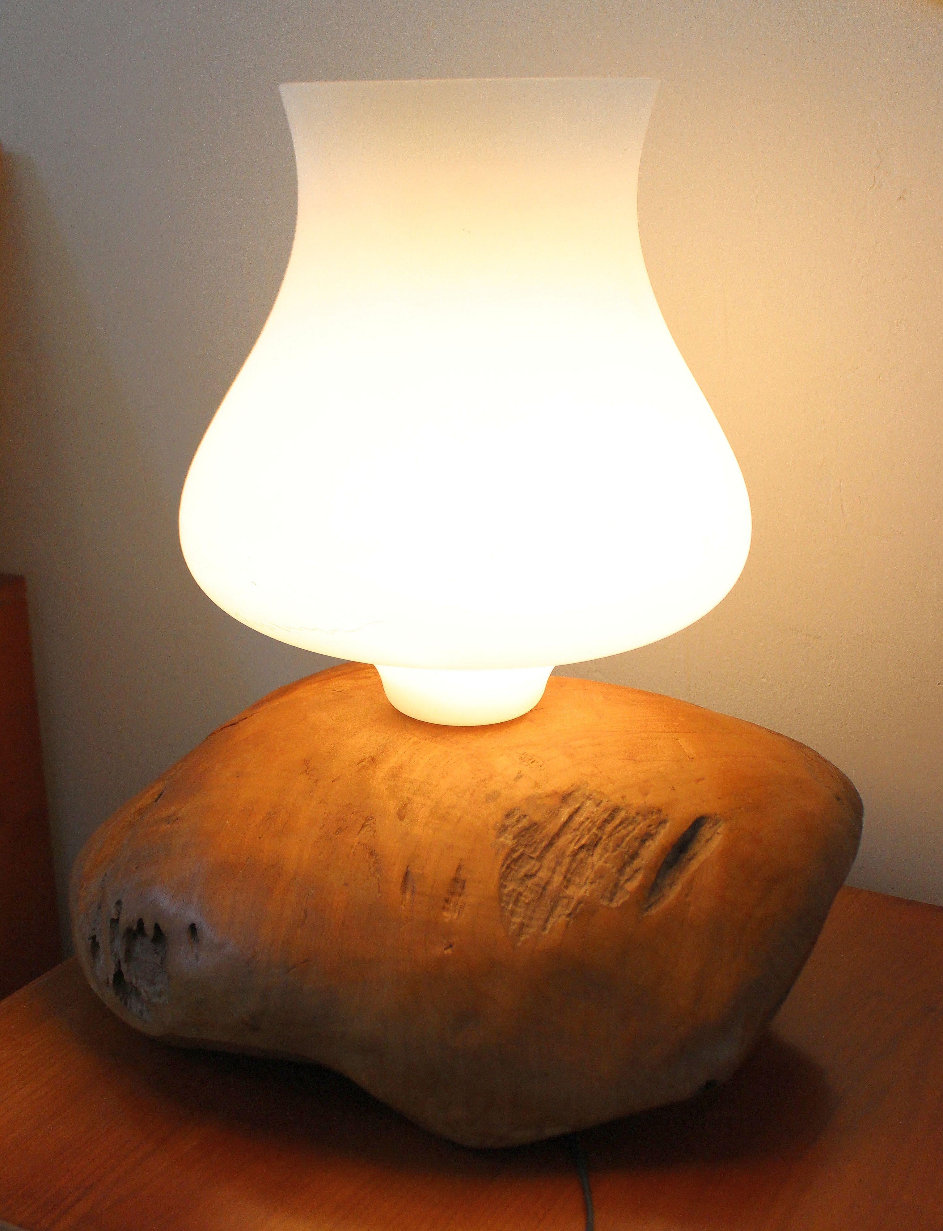 Italian table lamp by Gimo Fero Venation artist .Because of the size of the light fixtures it could be a floor lamp. Table lamp base is from the fallen long ago trees, and possible Olive tree. Murano white opaline glass shade.