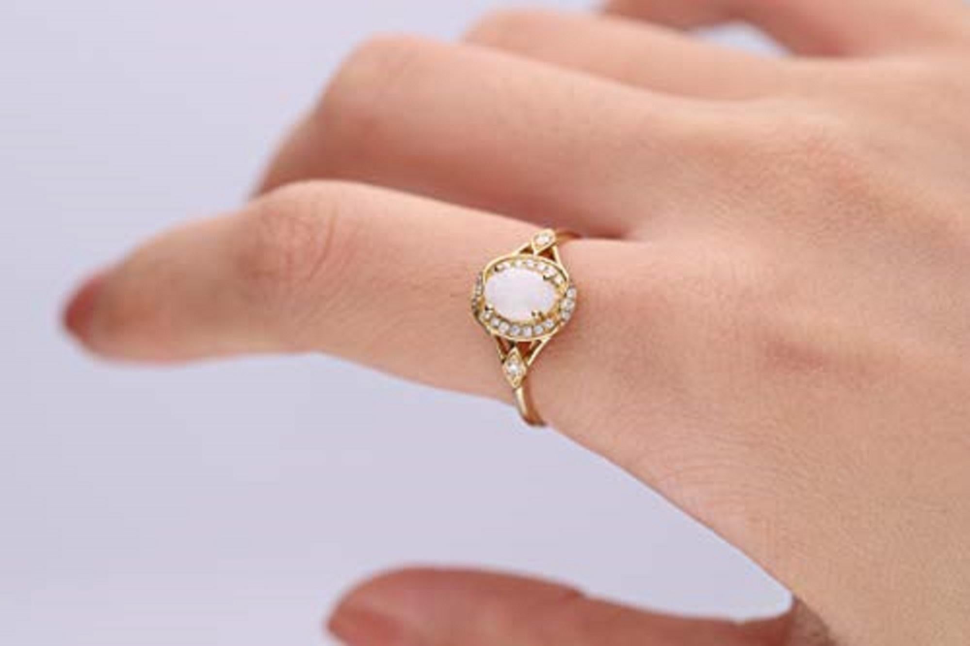 Stunning, timeless and classy eternity Unique ring. Decorate yourself in luxury with this Gin & Grace ring. This ring is made up of 5X7 Oval-Cut Prong Setting Natural opal (1pcs) 0.45 Carat and Round-Cut Prong Setting Diamond (22pcs) 0.11 Carat