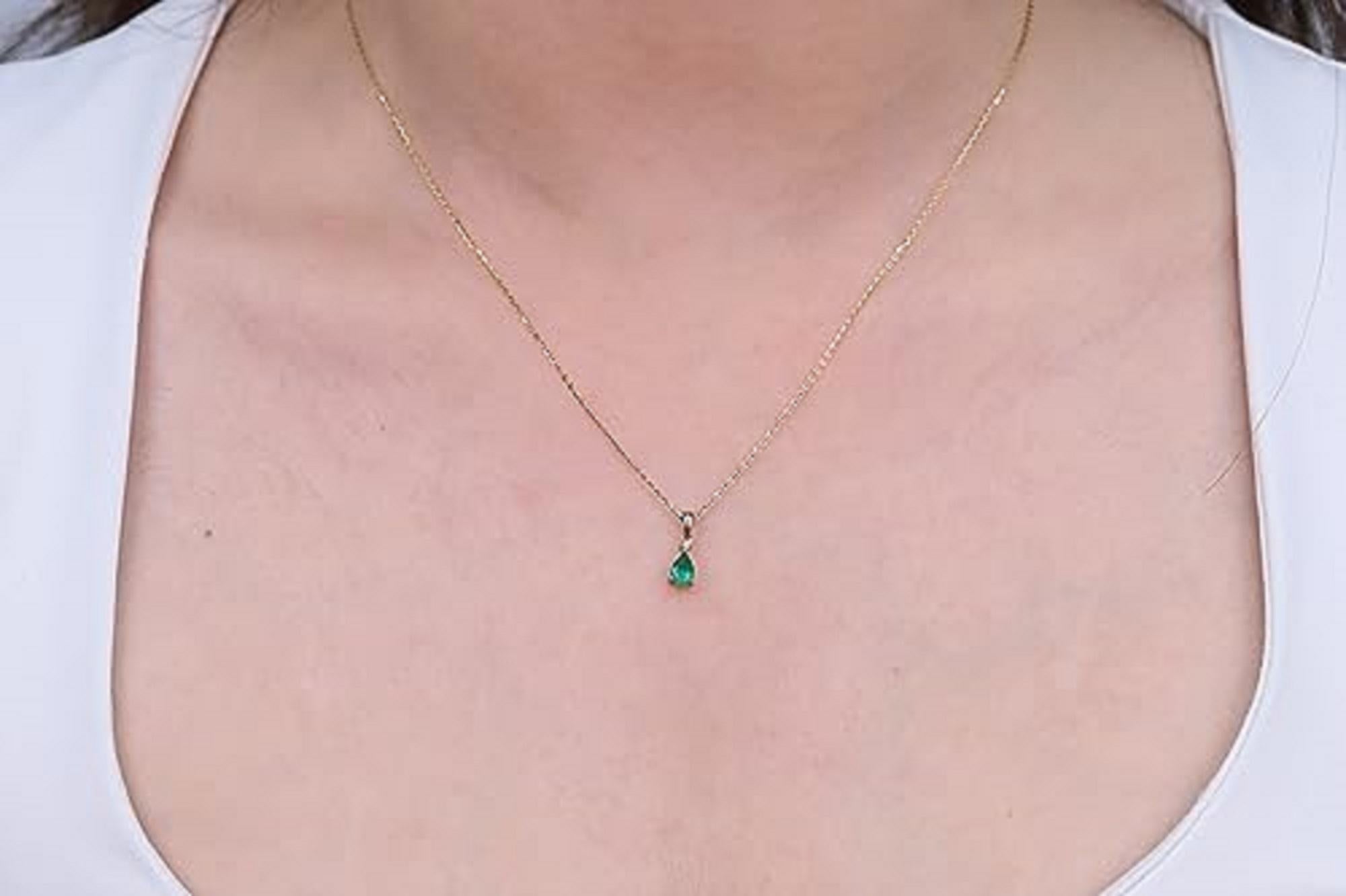 Decorate yourself in elegance with this Pendant is crafted from 10-karat Yellow Gold by Gin & Grace. This Pendant is made up of 6x4 mm Pear-cut Emerald (1 pcs) 0.33 carat and Round-cut White Diamond (1 Pcs) 0.01 Carat. This Pendant is weight 1.78
