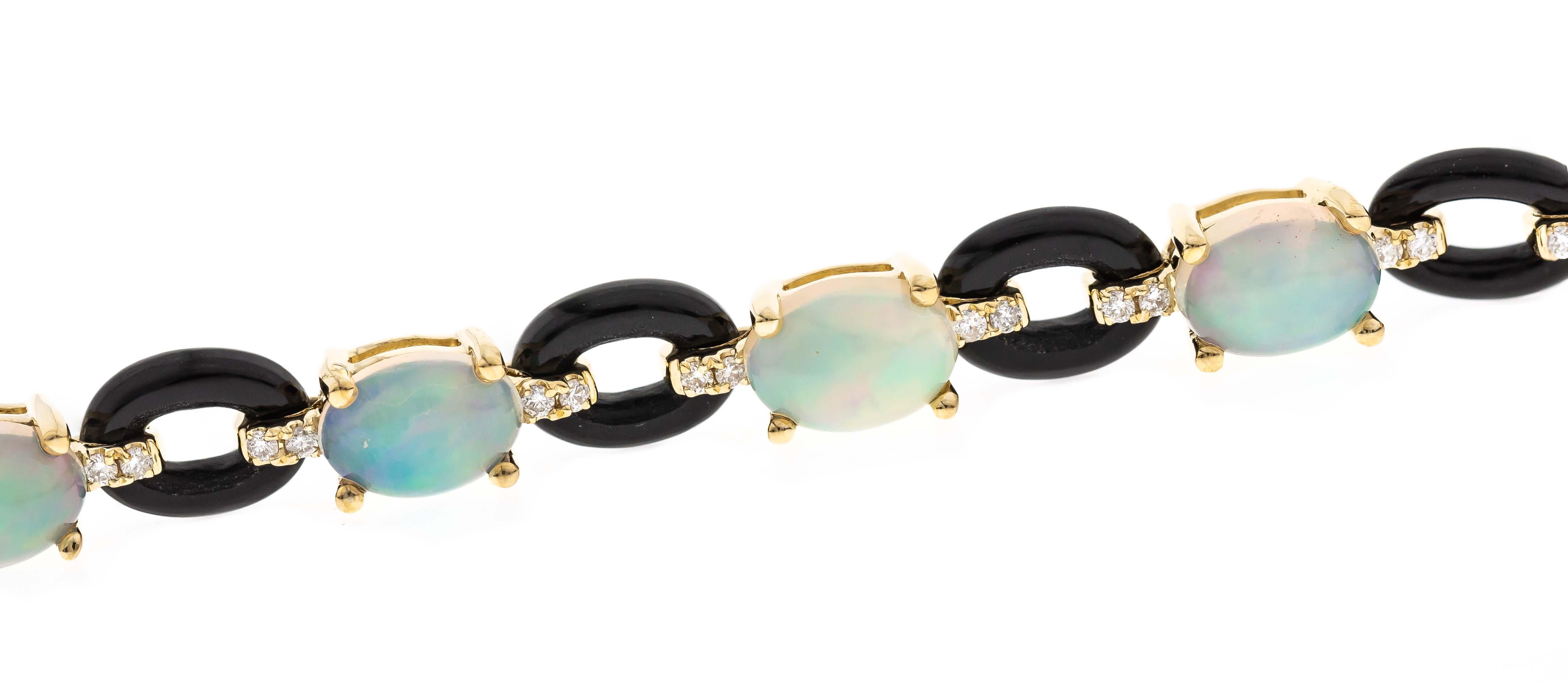 Bold and enchanting, this Ethiopian Opal and Onyx Chain Bracelet is a striking fusion of fire and elegance. The design features twelve captivating 5x7 mm Ethiopian Opals, totaling 6.45 carats, each glowing with an otherworldly play of color.