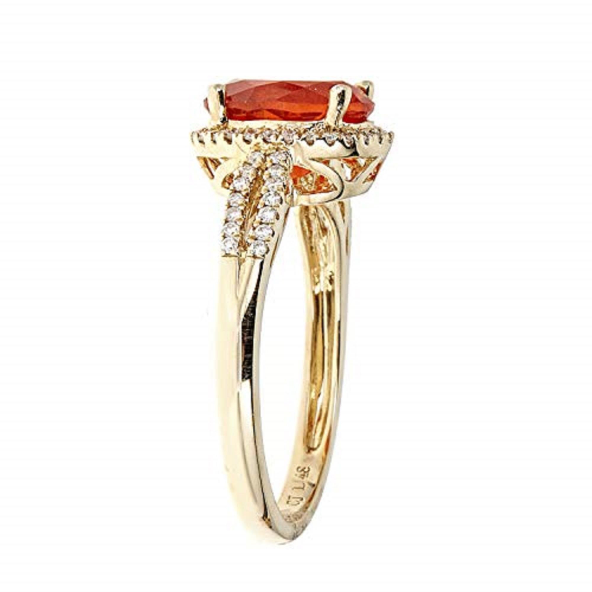 This Wedding ring from Gin & Grace features an oval-cut orange color Mexican Natural Fire Opal that will complement your loved one's unique sense of style. Crafted from 14k Yellow Gold and accented with round-cut diamonds for a glittering finish