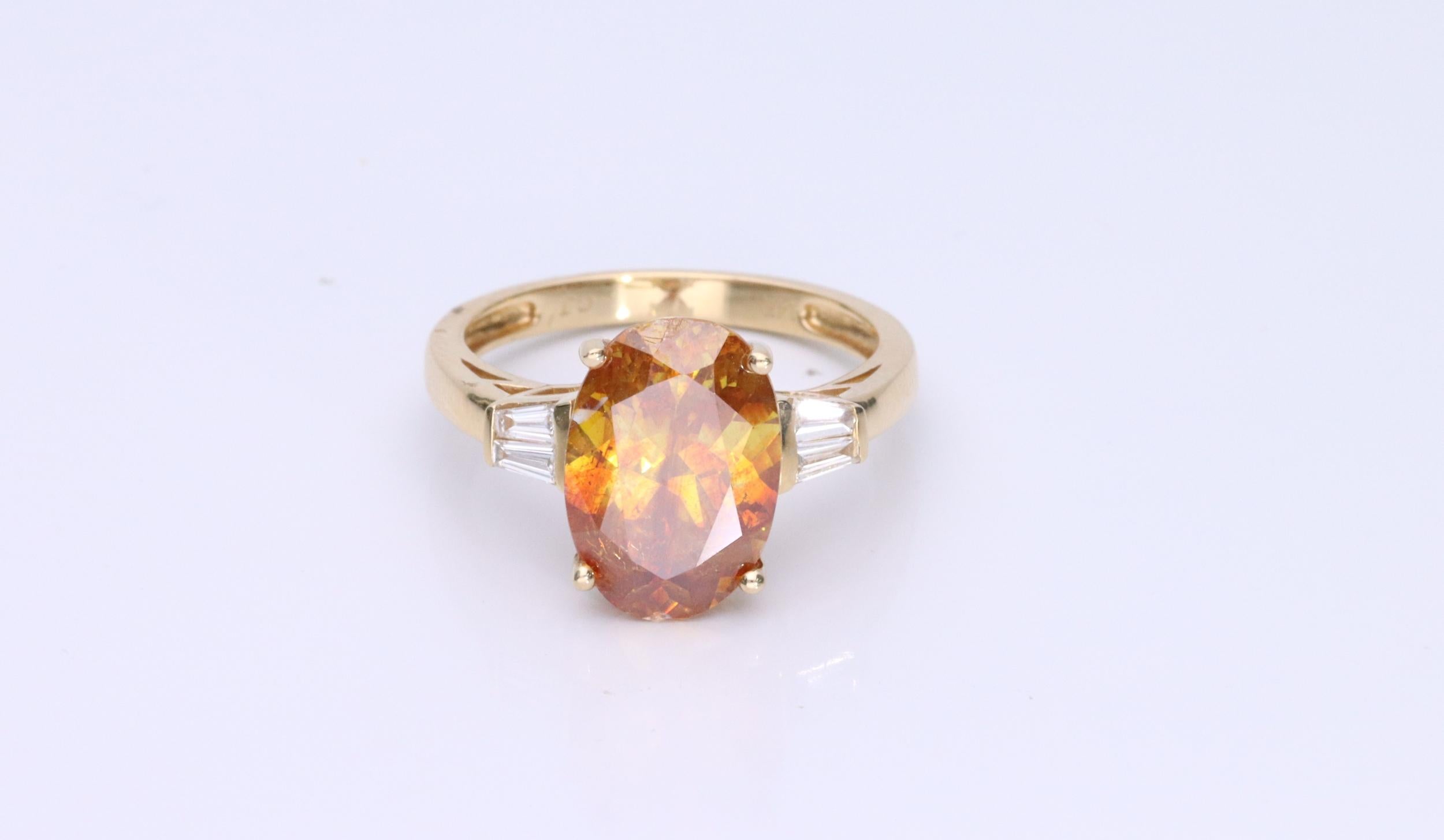 Decorate yourself in elegance with this Ring is crafted from 14-karat Yellow Gold by Gin & Grace. This Ring is made up of Oval-Cut (1 pcs) 8.36 carat Sphalerite and Baguette-cut White Diamond (4 Pcs) 0.18 carat. This Ring is weight 2.70 grams. This