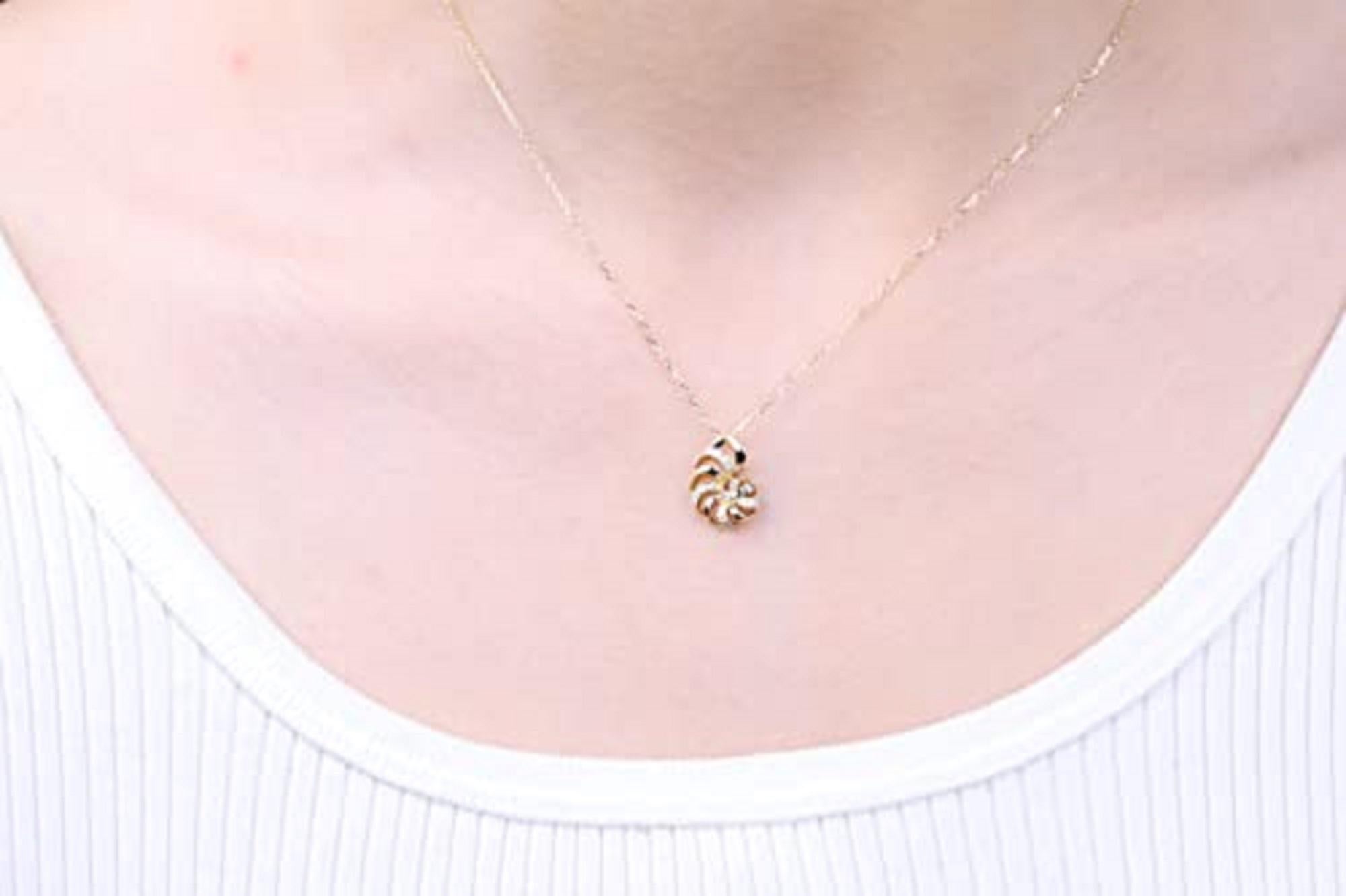 Decorate yourself in elegance with this Pendant is crafted from 14-karat Yellow Gold by Gin & Grace. This Pendant is Round-cut White Diamond (16 Pcs) 0.11 Carat. The pendant is designed by the Smithsonian. This Pendant is weight 1.52 grams and 1.50