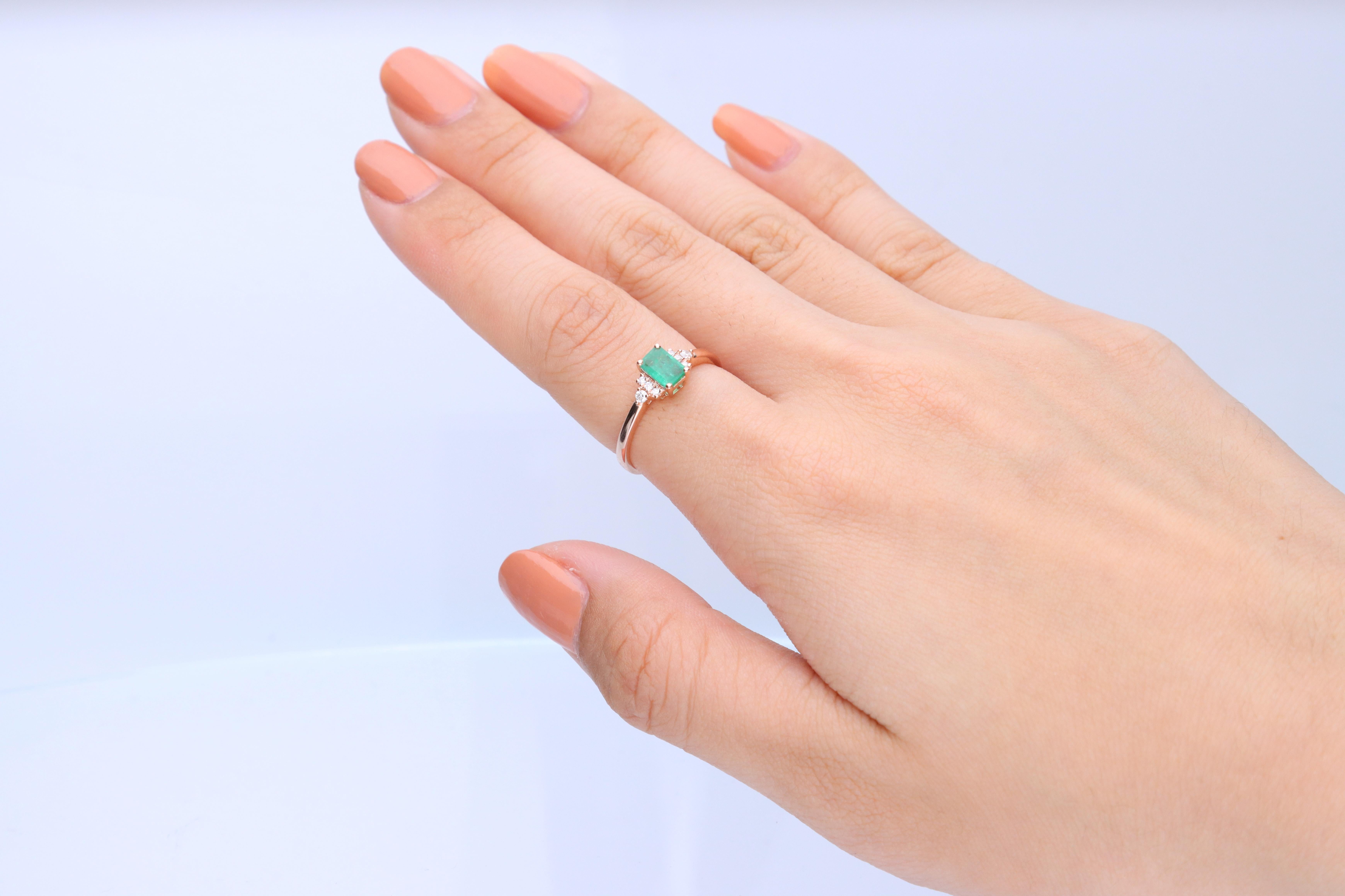 Decorate yourself in elegance with this Ring is crafted from 10-karat Rose Gold by Gin & Grace. This Ring is made up of 4*6 Emerald Emerald-cut (1 pcs) 0.55 and Round-cut Diamond (8 pcs) 0.08 Carat. This Ring is weight 1.32 grams. This delicate Ring