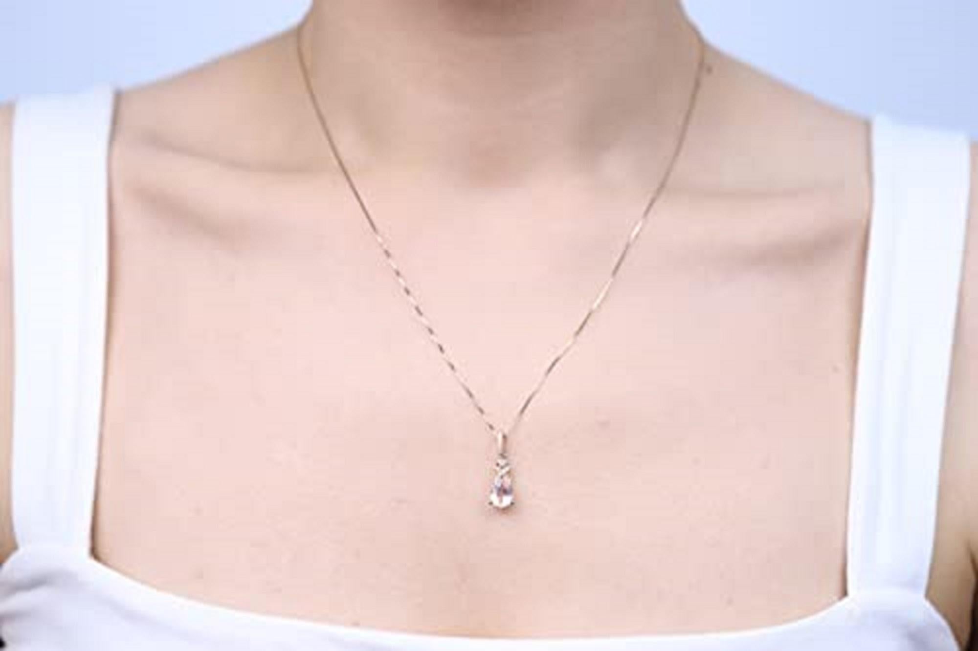Decorate yourself in luxury with this Gin & Grace Pendant. The 10k Rose Gold jewelry boasts 6X8 Pear-Cut Prong Setting Genuine Morganite (1pcs) 0.87 Carat and Round-Cut Prong Setting Natural Diamond (15pcs) 0.11 Carat accent stones for a lovely