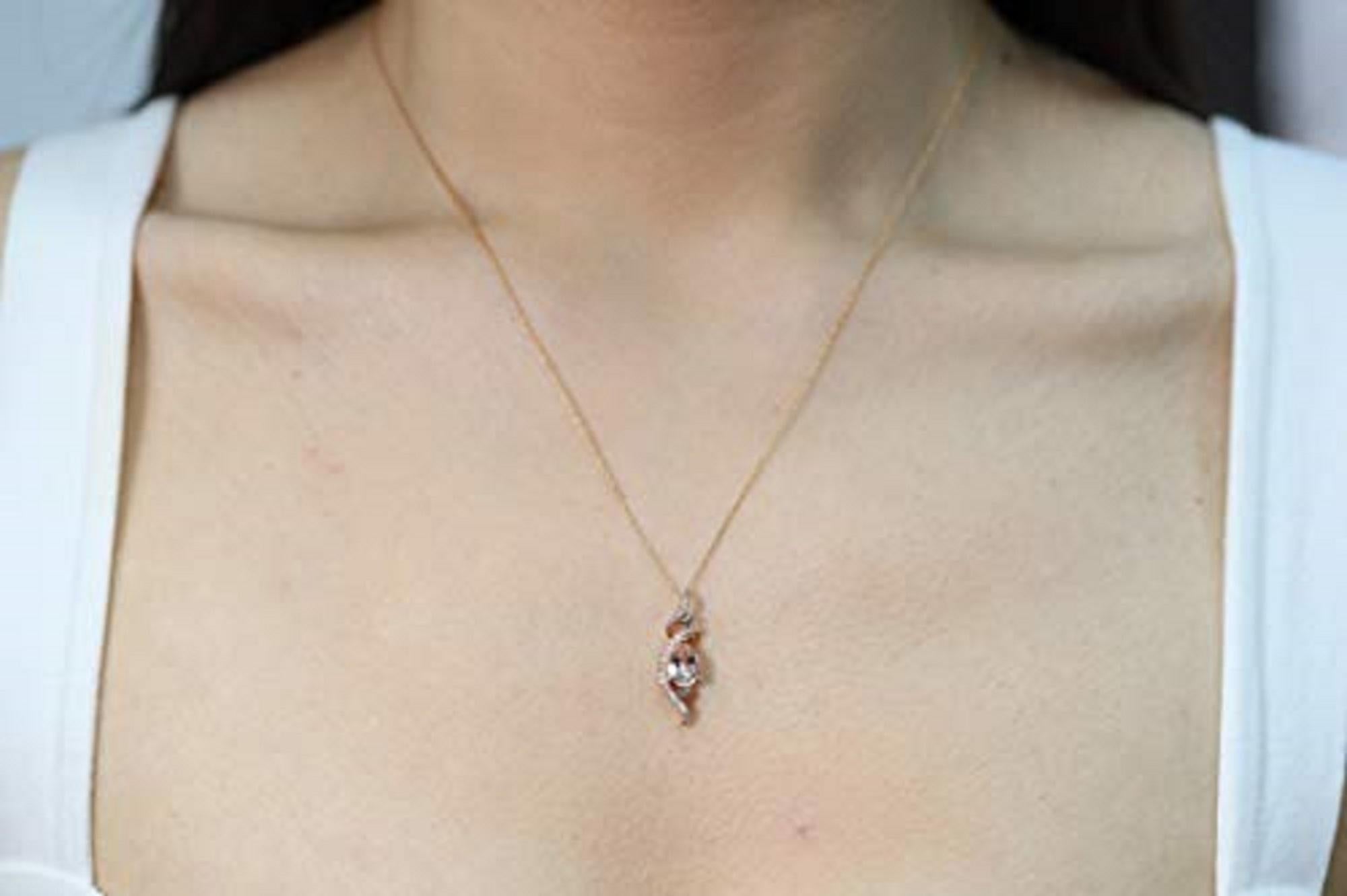 Decorate yourself in elegance with this Pendant is crafted from 10-karat Rose Gold by Gin & Grace Pendant. This Pendant is made up of 6X8 Pear-Cut Prong setting Genuine Morganite (1 Pcs) 0.88 Carat and Round-Cut Prong setting Natural Brown Diamond
