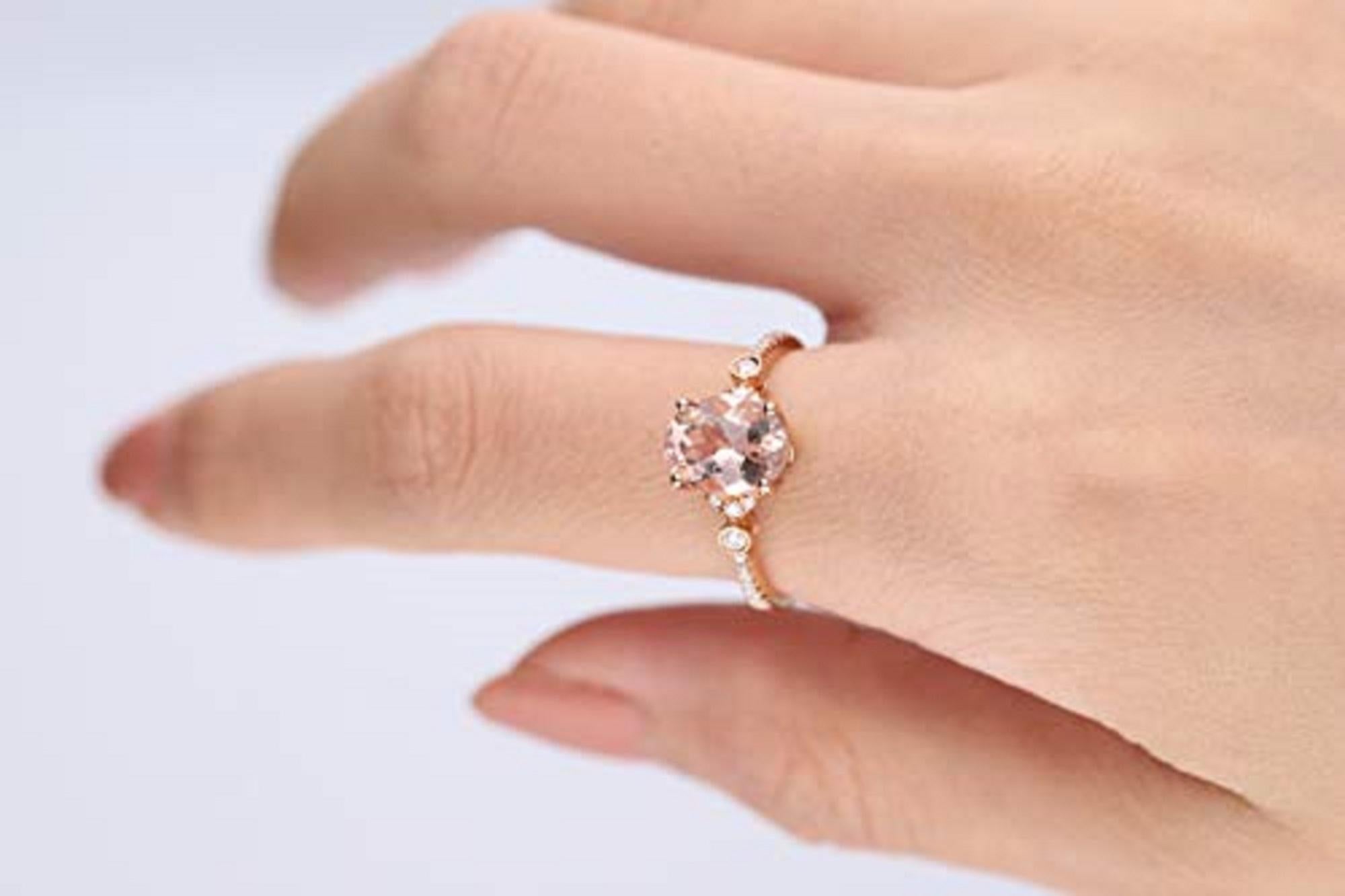 Stunning, timeless and classy eternity Engagement ring. Decorate yourself in luxury with this The Gin & Grace ring. This ring is made up of 7X9 Oval-Cut Prong Setting Genuine Morganite (1 pcs) 1.72 Carat and Round-Cut Prong Setting Natural Diamond