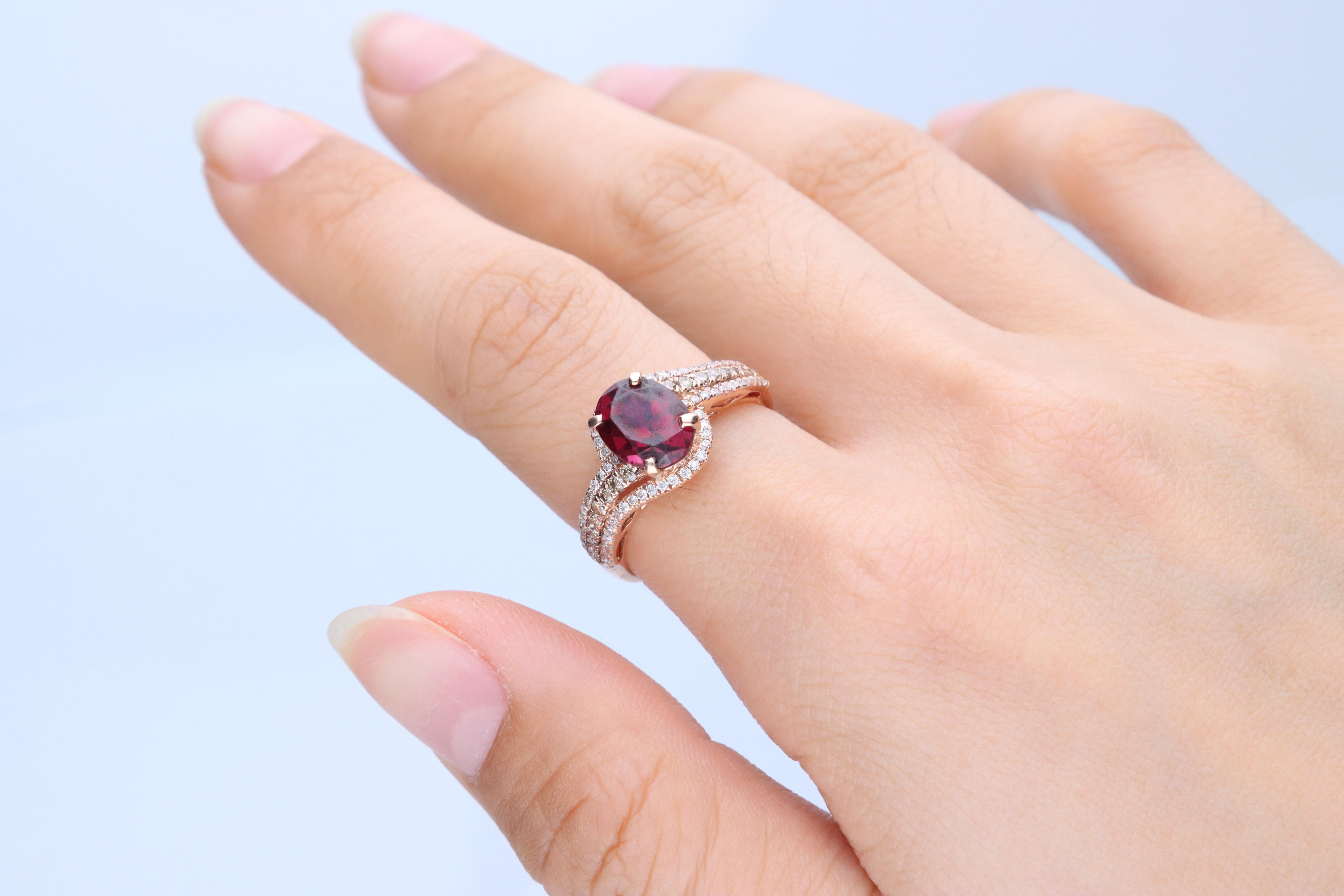 Stunning, timeless and classy eternity Unique Ring. Decorate yourself in luxury with this Gin & Grace Ring. The 10K Rose Gold jewelry boasts Oval-Cut Prong Setting Purplish Pink Natural Garnet (1 pcs) 2.31 Carat, along with Natural Round cut white