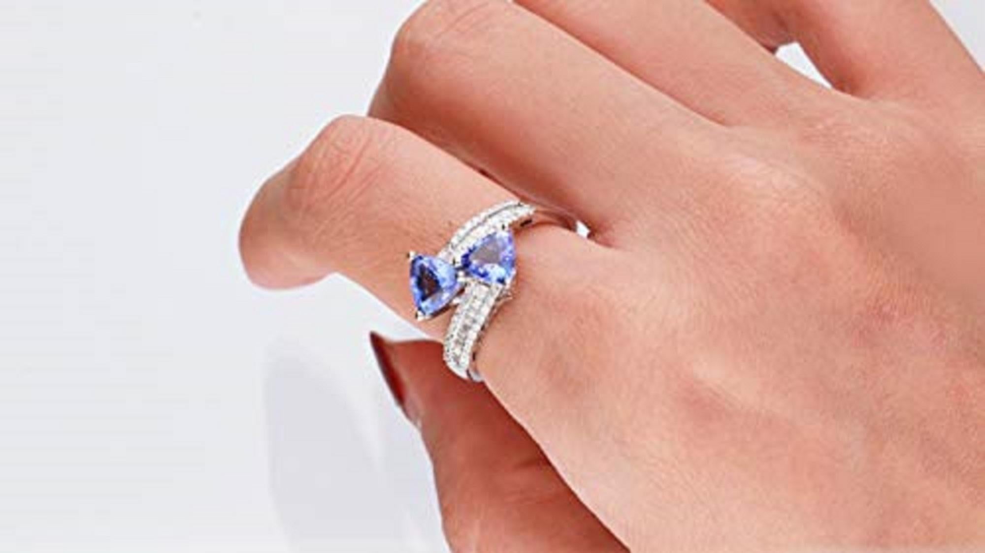 Stunning, timeless and classy eternity Unique ring. Decorate yourself in luxury with this Gin & Grace ring. This ring is made up of 6MM Trillion-Cut Prong Setting Tanzanite (2 pcs) 1.36 Carat and Round-Cut Prong Setting Diamond (42 pcs) 0.21 Carat,
