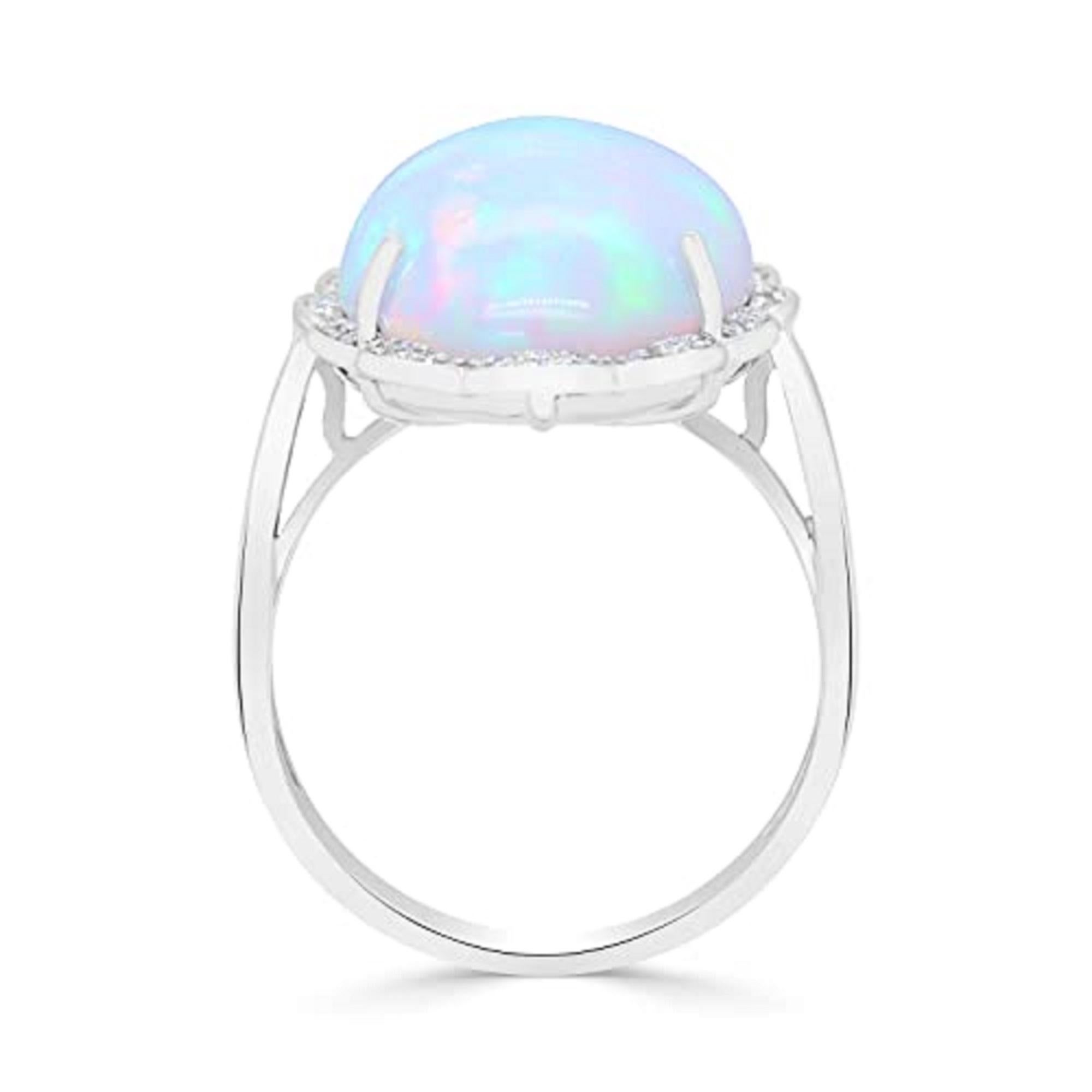 Decorate yourself in elegance with this Ring is crafted from 10-karat white Gold by Gin & Grace. This Ring is made up of 13*20 mm Ethiopian opal oval-cab (1 pcs) 8.72 carat and Round-cut Diamond (36 pcs) 0.11 Carat. This Ring is weight 3.91 grams.