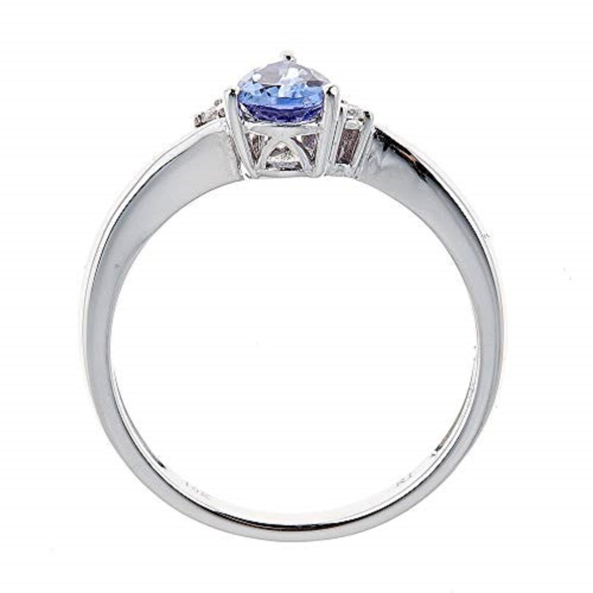 Stunning, timeless and classy eternity Unique Ring. Decorate yourself in luxury with this Gin & Grace Ring. This Ring is made up of Pear-Cut Prong Setting Blue Natuaral Tanzanite (1 pc) 0.91 Carat and Round-Cut Prong Setting White Diamond (2 pcs)