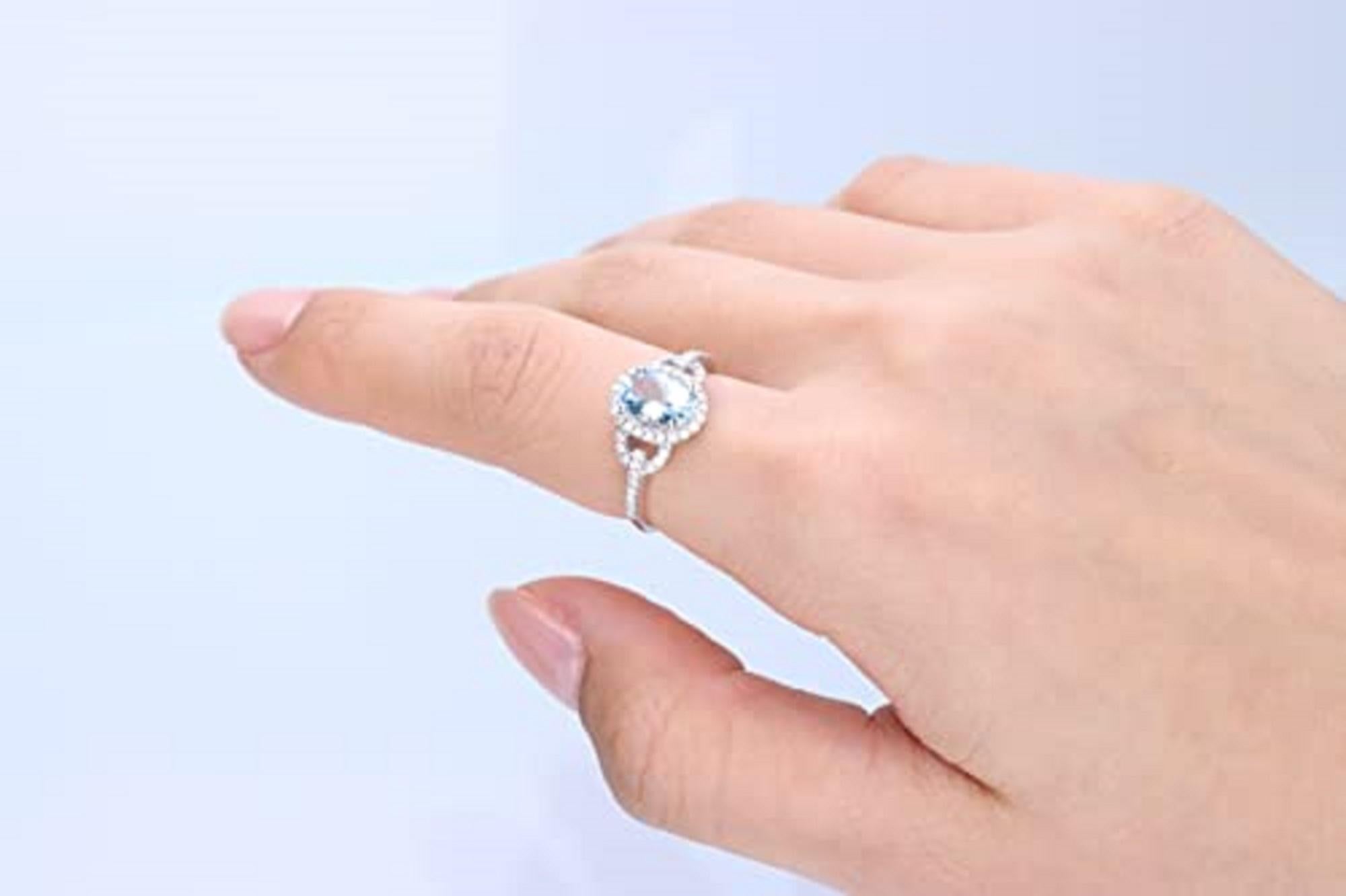 Decorate yourself in elegance with this Ring is crafted from 10-karat White Gold by Gin & Grace. This Ring is made up of 8x6 mm Oval-Cut Aquamarine (1 pcs) 1.12 carat and Round-cut White Diamond (50 Pcs) 0.25 Carat. This Ring is weight 2.36 grams.