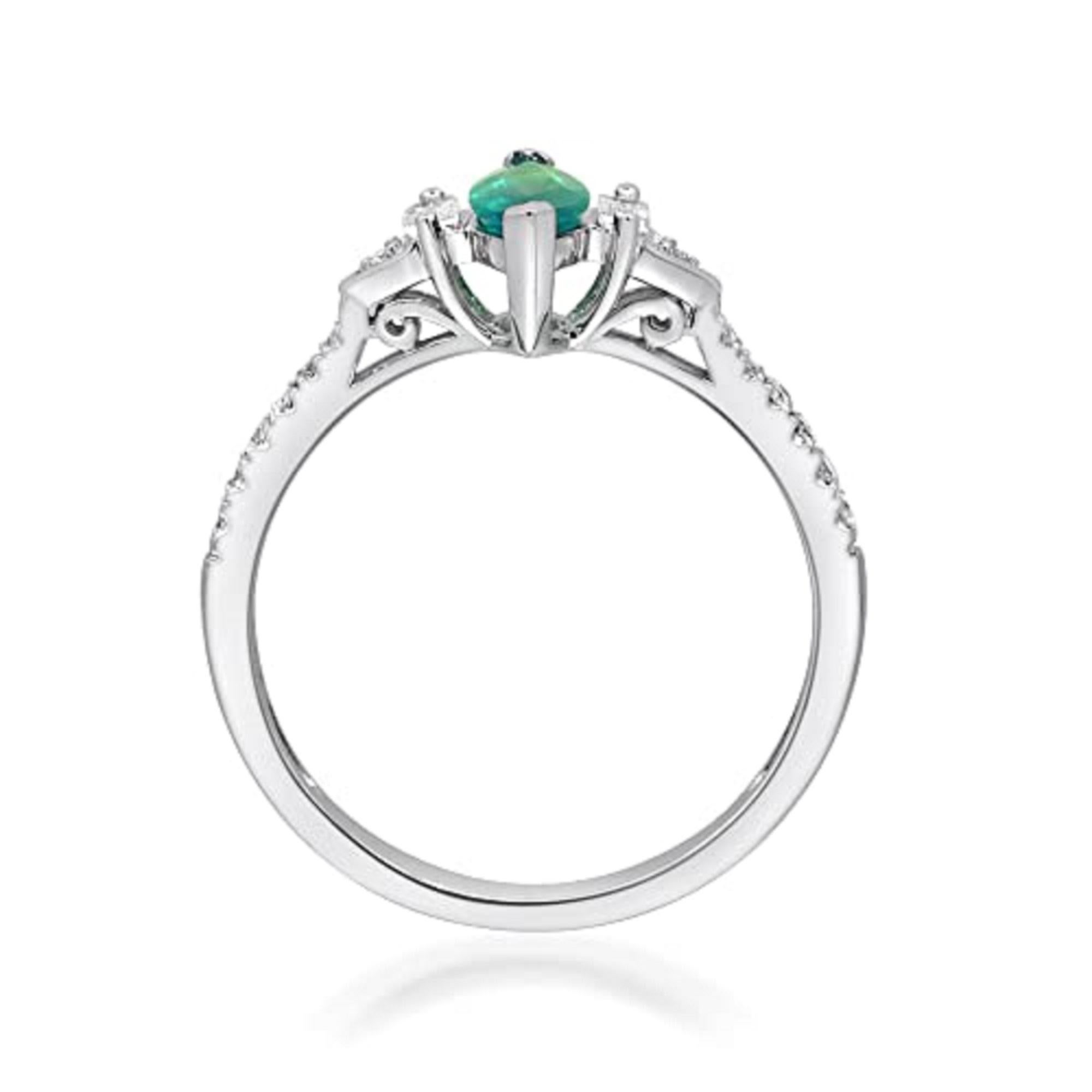 Decorate yourself in elegance with this Ring is crafted from 10-karat White Gold by Gin & Grace. This Ring is made up of 8x4 mm Marquise-Cut Emerald (1 pcs) 0.53 carat and Round-cut White Diamond (14 Pcs) 0.11 Carat, Baguette-cut White Diamond (2