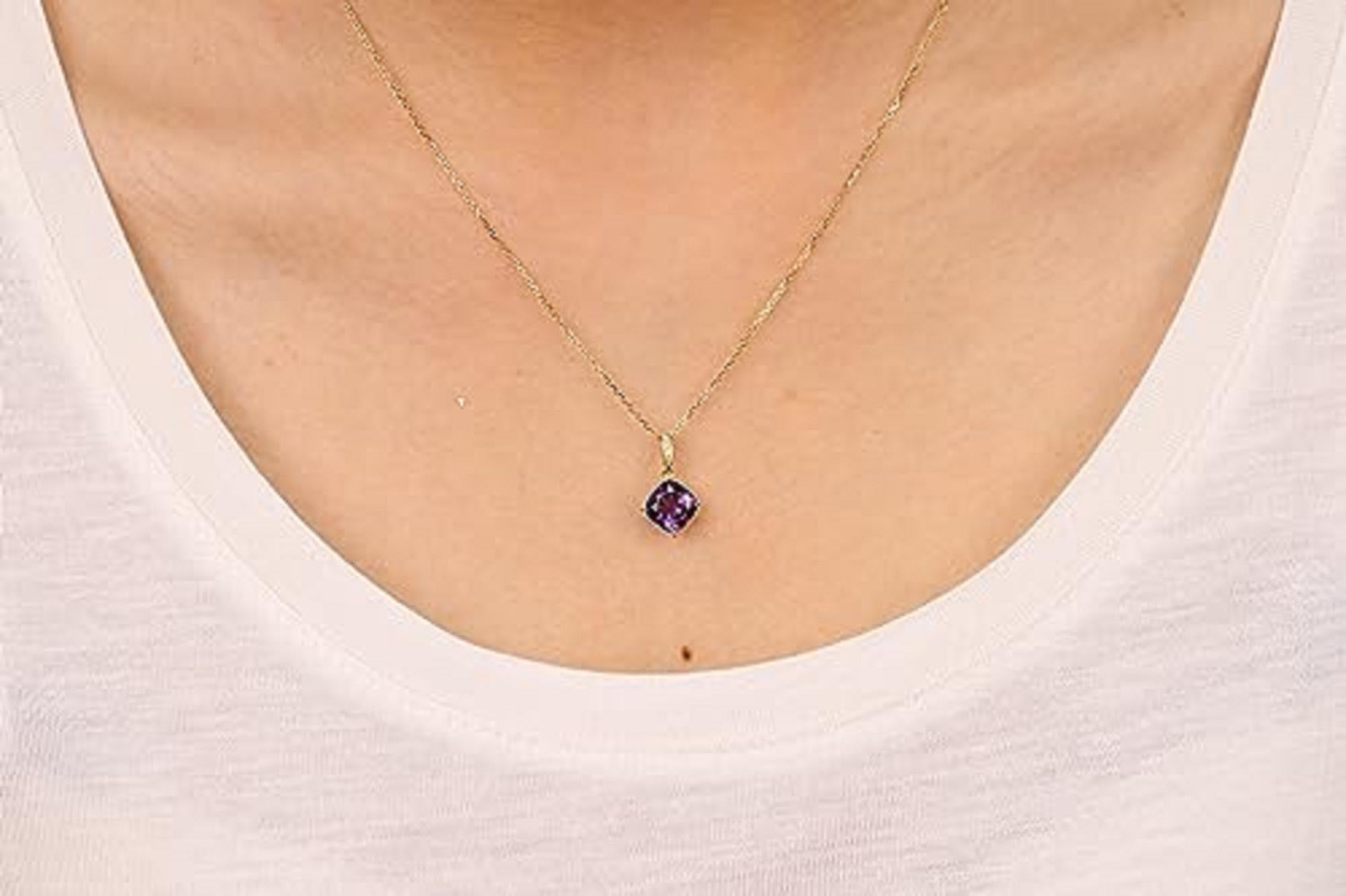 Decorate yourself in elegance with this Pendant is crafted from 10-karat Yellow Gold by Gin & Grace. This Pendant is made up of 7.0 mm Cushion-cut Amethyst (1 pcs) 1.44 carat and Round-cut White Diamond (3 Pcs) 0.01 Carat. This Pendant is weight