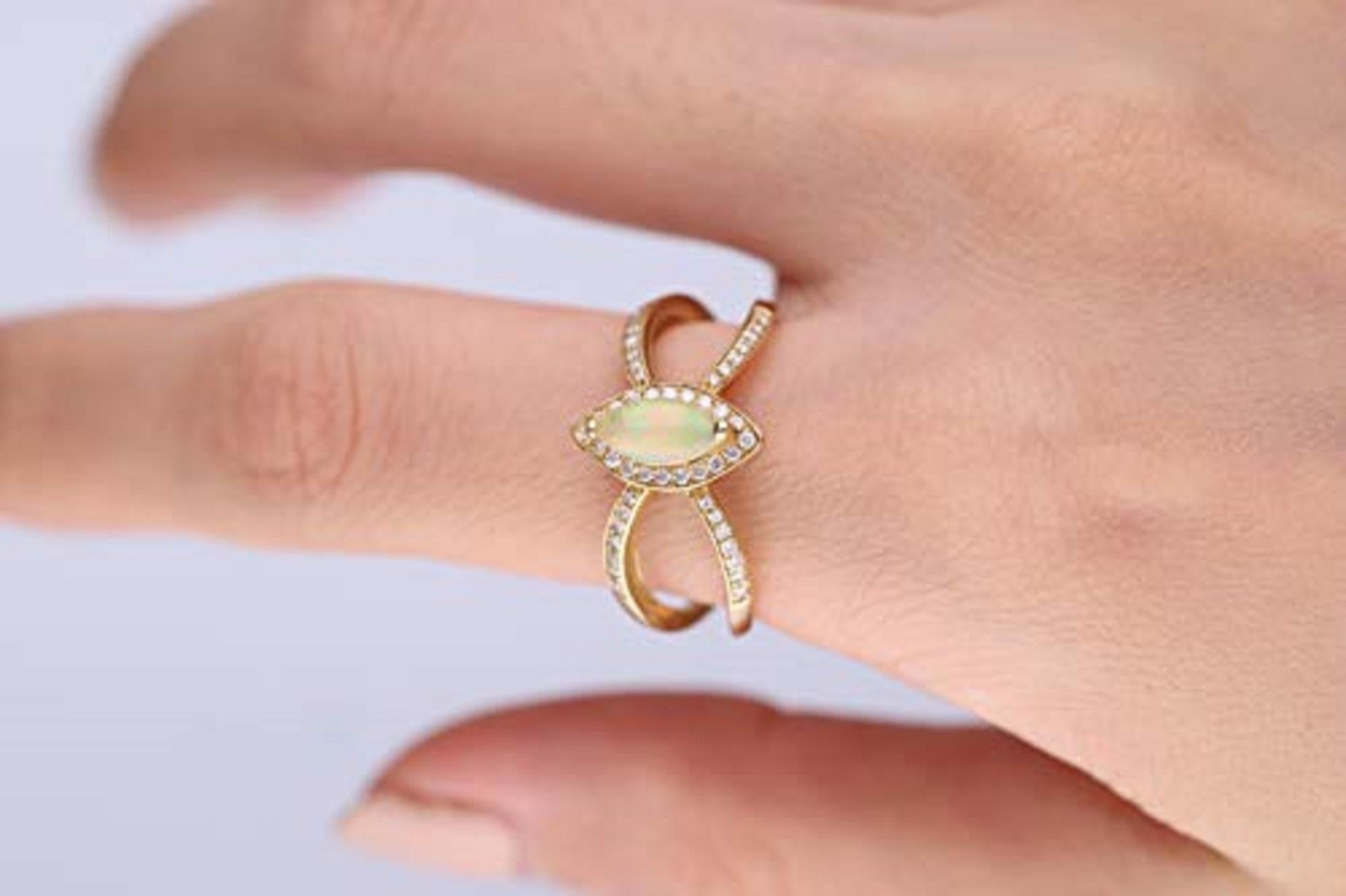 Stunning, timeless and classy eternity Unique Ring. Decorate yourself in luxury with this Gin & Grace Ring. The 10K Yellow Gold jewelry boasts Marquise-Cut Prong Setting Natural Opal (1 pcs) 0.48 Carat, along with Natural Round cut white Diamond (48