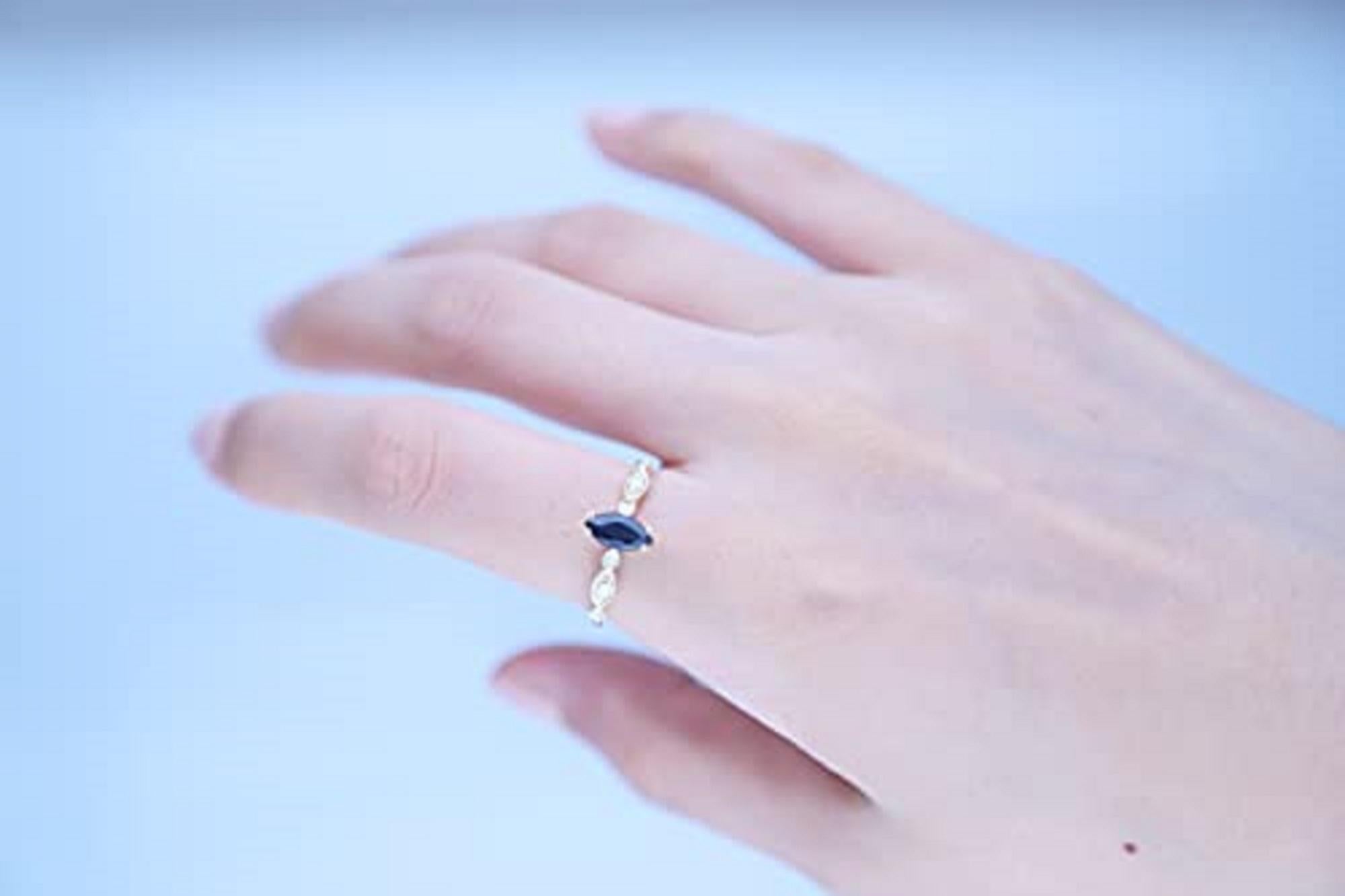 Decorate yourself in elegance with this Ring is crafted from 10-karat Yellow Gold by Gin & Grace Ring. This Ring is made up of 8x4 mm Marquise-Cut Blue Sapphire (1 pcs) 0.62 carat and Round-cut White Diamond (6 Pcs) 0.10 Carat. This Ring is weight